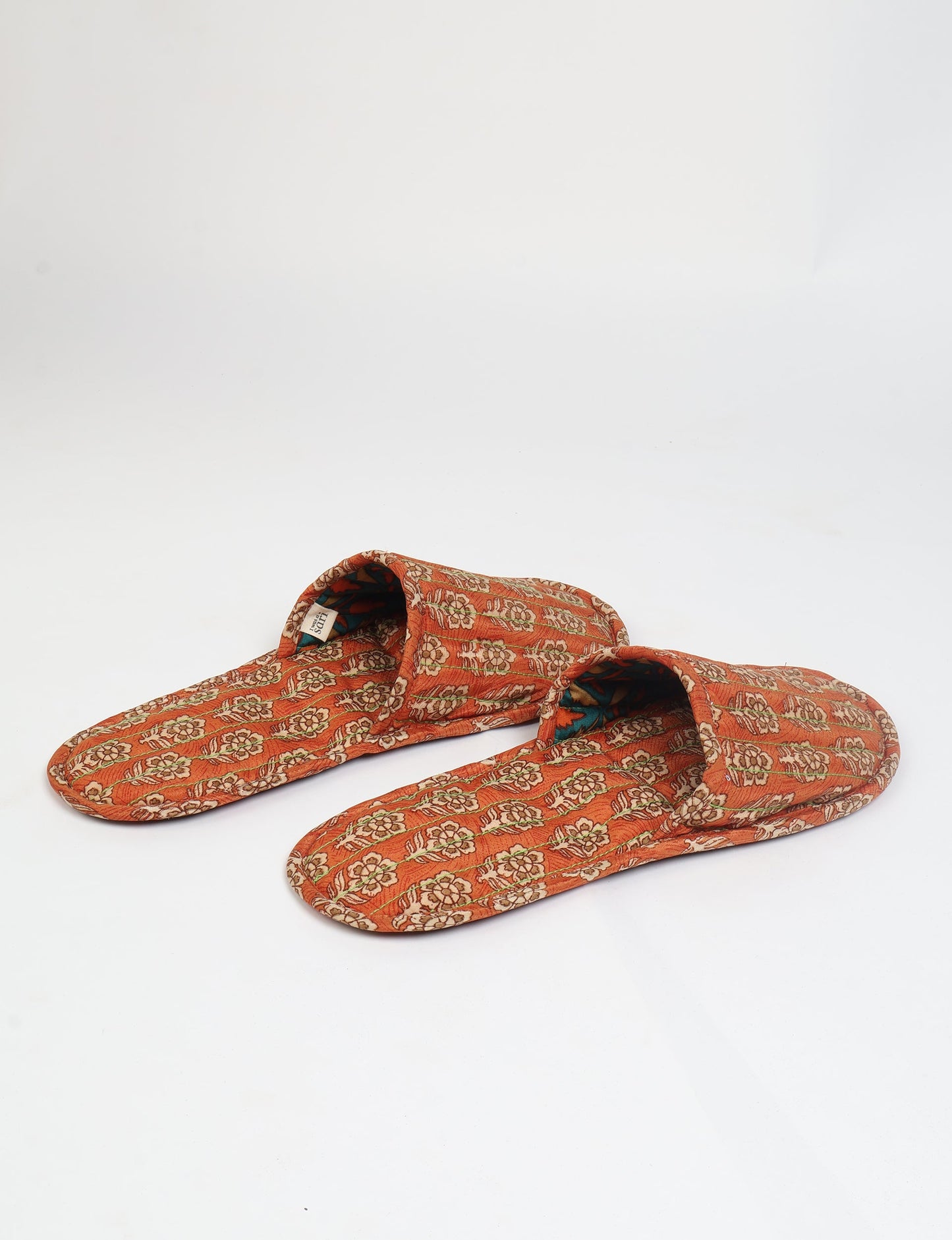 Elevate your downtime with our Quilted Slippers. Ethical, sustainable, and crafted by female artisans in Mumbai, these slippers offer cushioned comfort with a touch of chic style. Warm on the inside, fashionable on the outside, step into sustainable luxury.