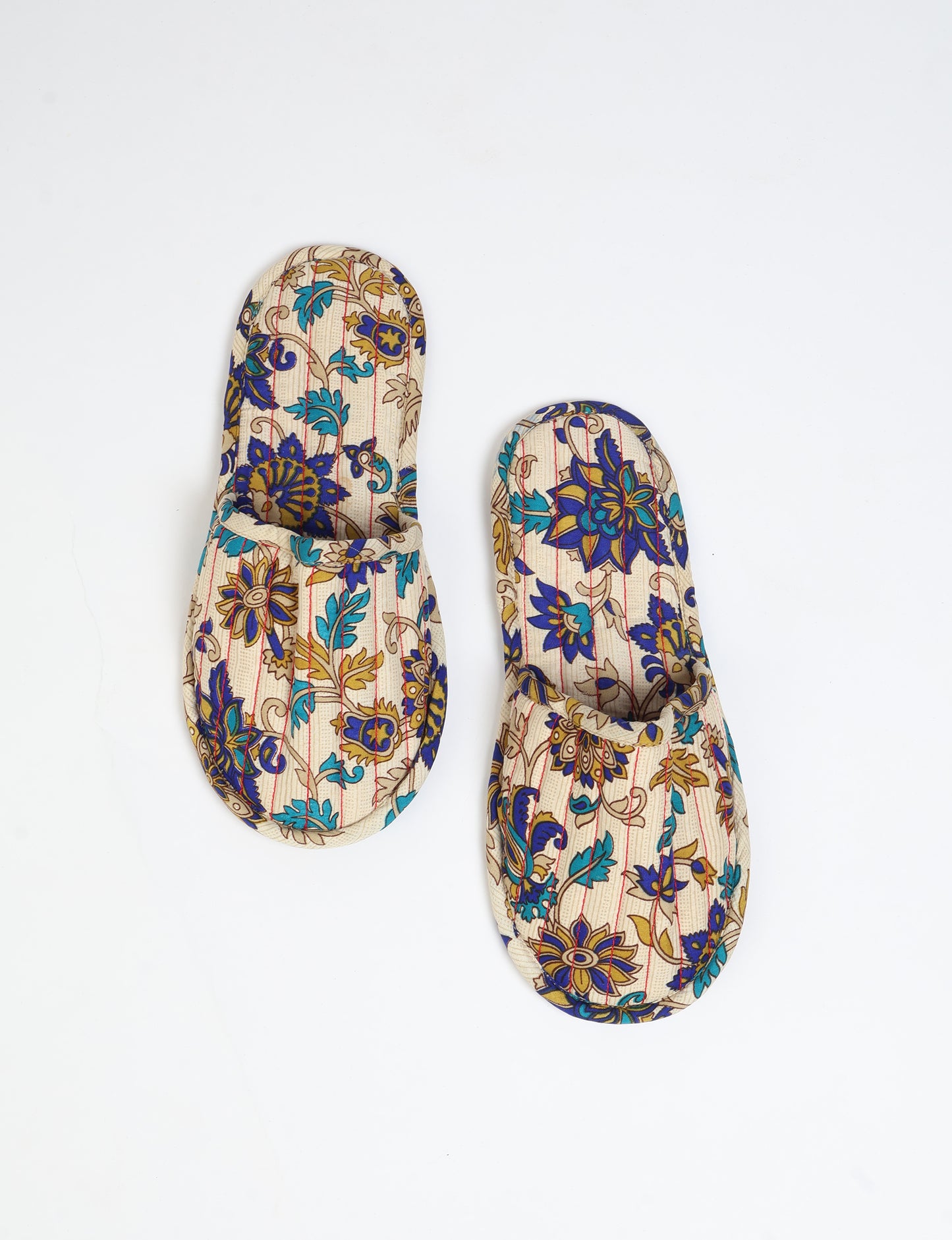 Elevate your downtime with our Quilted Slippers. Ethical, sustainable, and crafted by female artisans in Mumbai, these slippers offer cushioned comfort with a touch of chic style. Warm on the inside, fashionable on the outside, step into sustainable luxury.