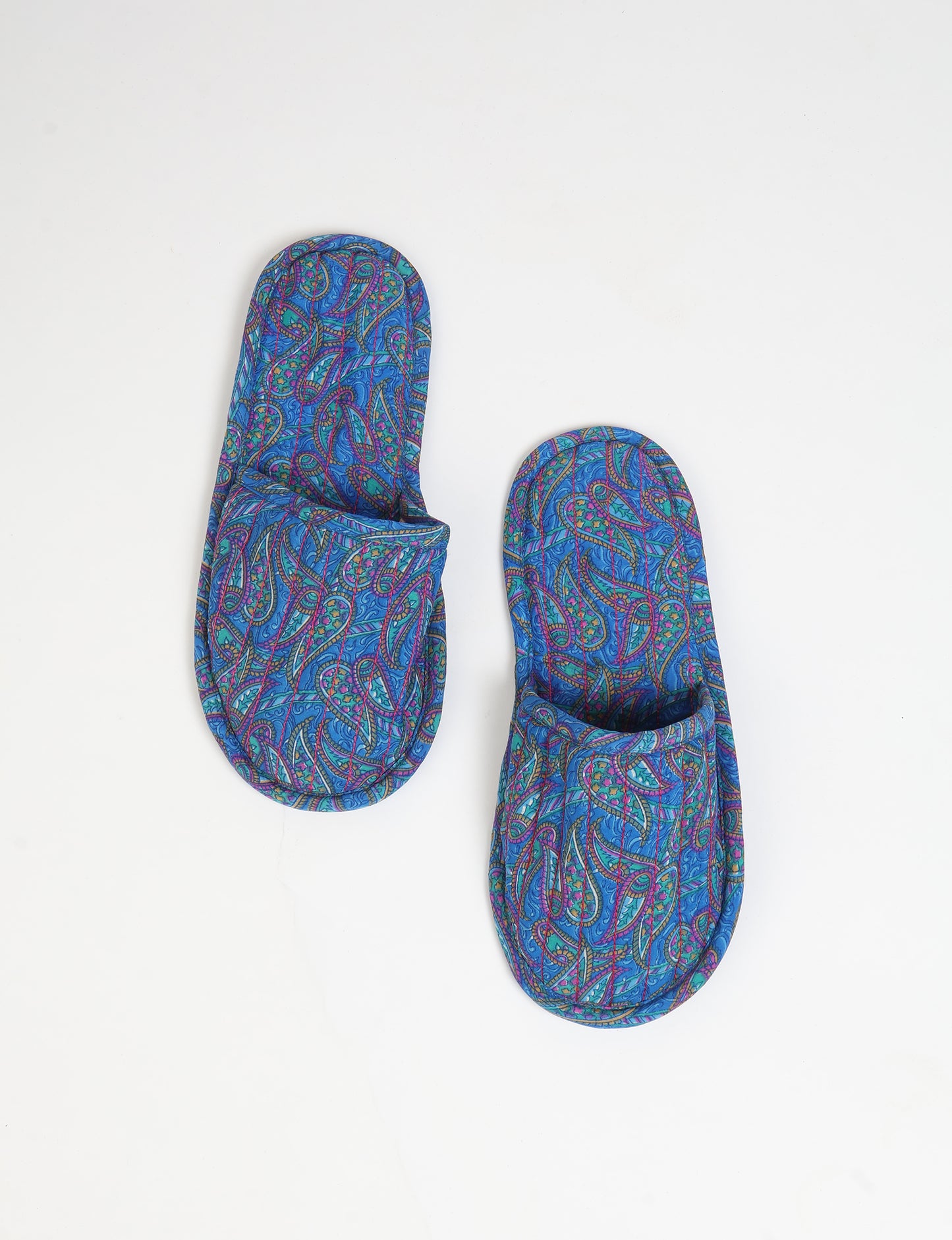 Elevate your downtime with our Quilted Slippers. Ethical, sustainable, and crafted by female artisans in Mumbai, these slippers offer cushioned comfort with a touch of chic style. Warm on the inside, fashionable on the outside, step into sustainable luxury.