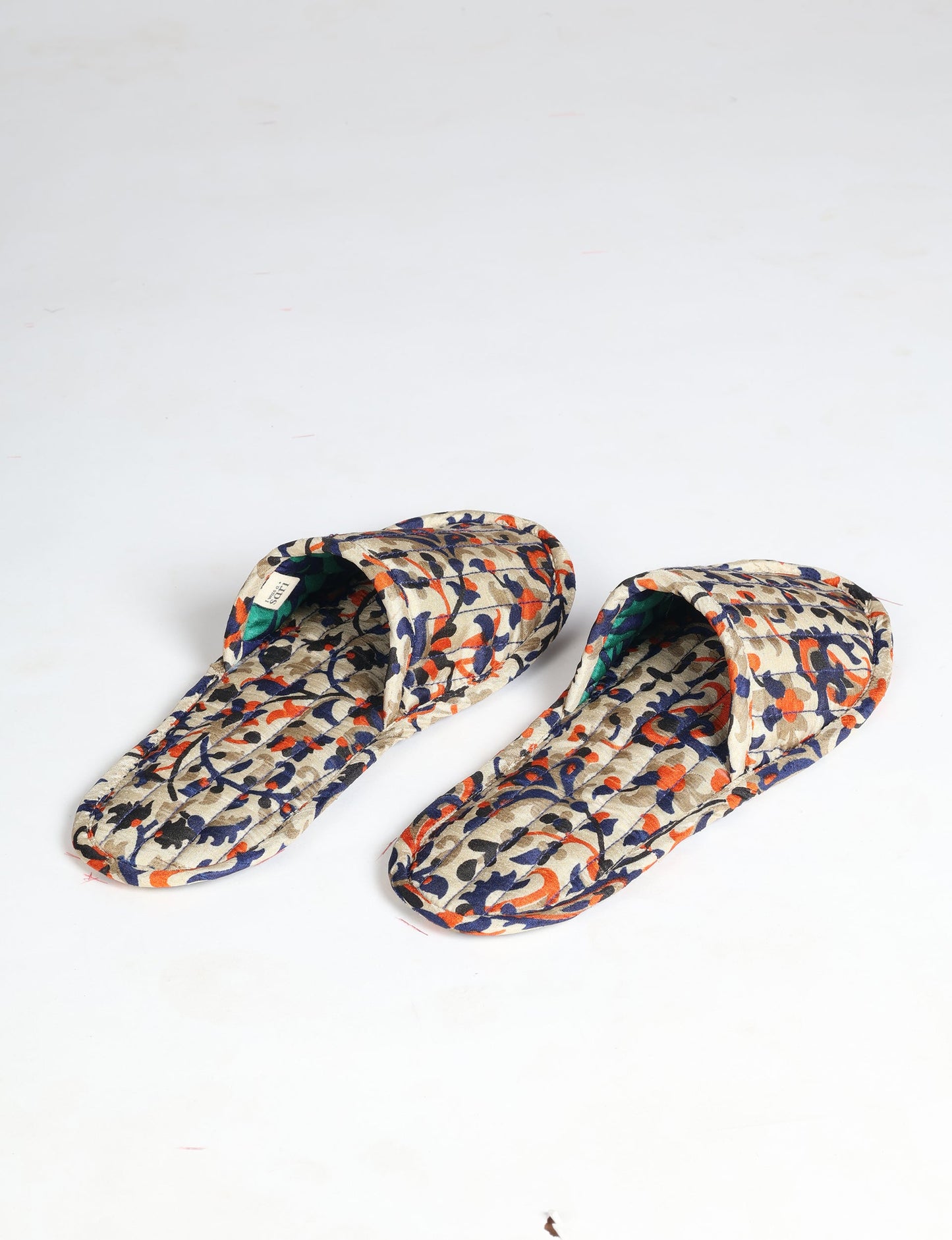 Elevate your downtime with our Quilted Slippers. Ethical, sustainable, and crafted by female artisans in Mumbai, these slippers offer cushioned comfort with a touch of chic style. Warm on the inside, fashionable on the outside, step into sustainable luxury.