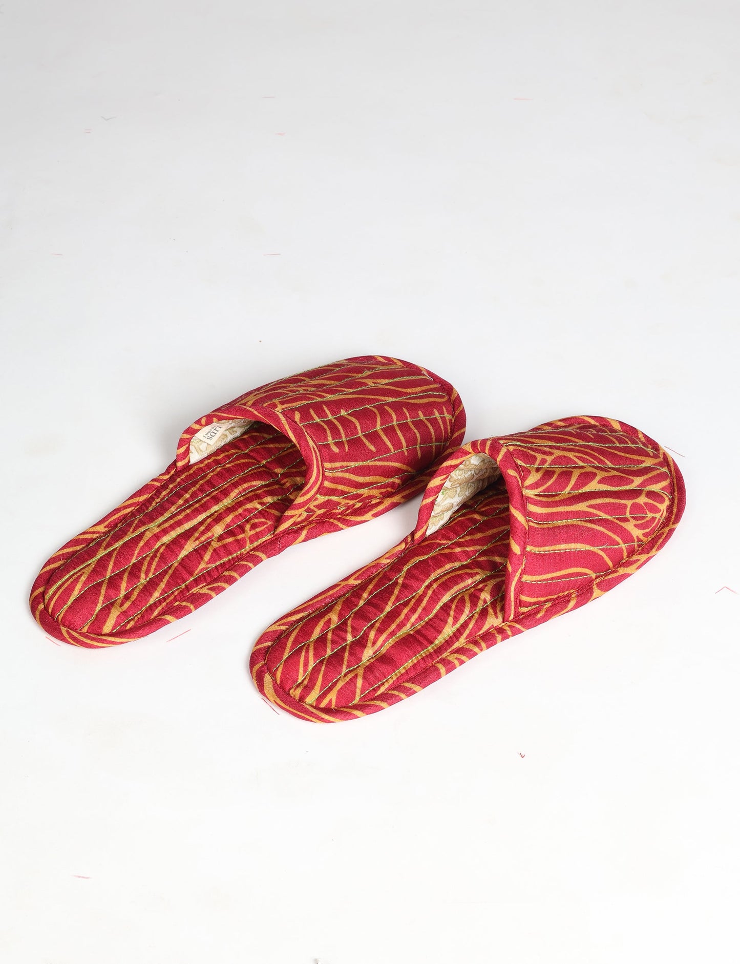 Elevate your downtime with our Quilted Slippers. Ethical, sustainable, and crafted by female artisans in Mumbai, these slippers offer cushioned comfort with a touch of chic style. Warm on the inside, fashionable on the outside, step into sustainable luxury.