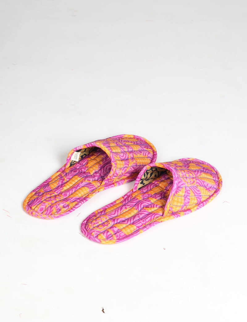 Quilted slippers in pink and orange floral pattern with open toe design, shown from top angle on white background