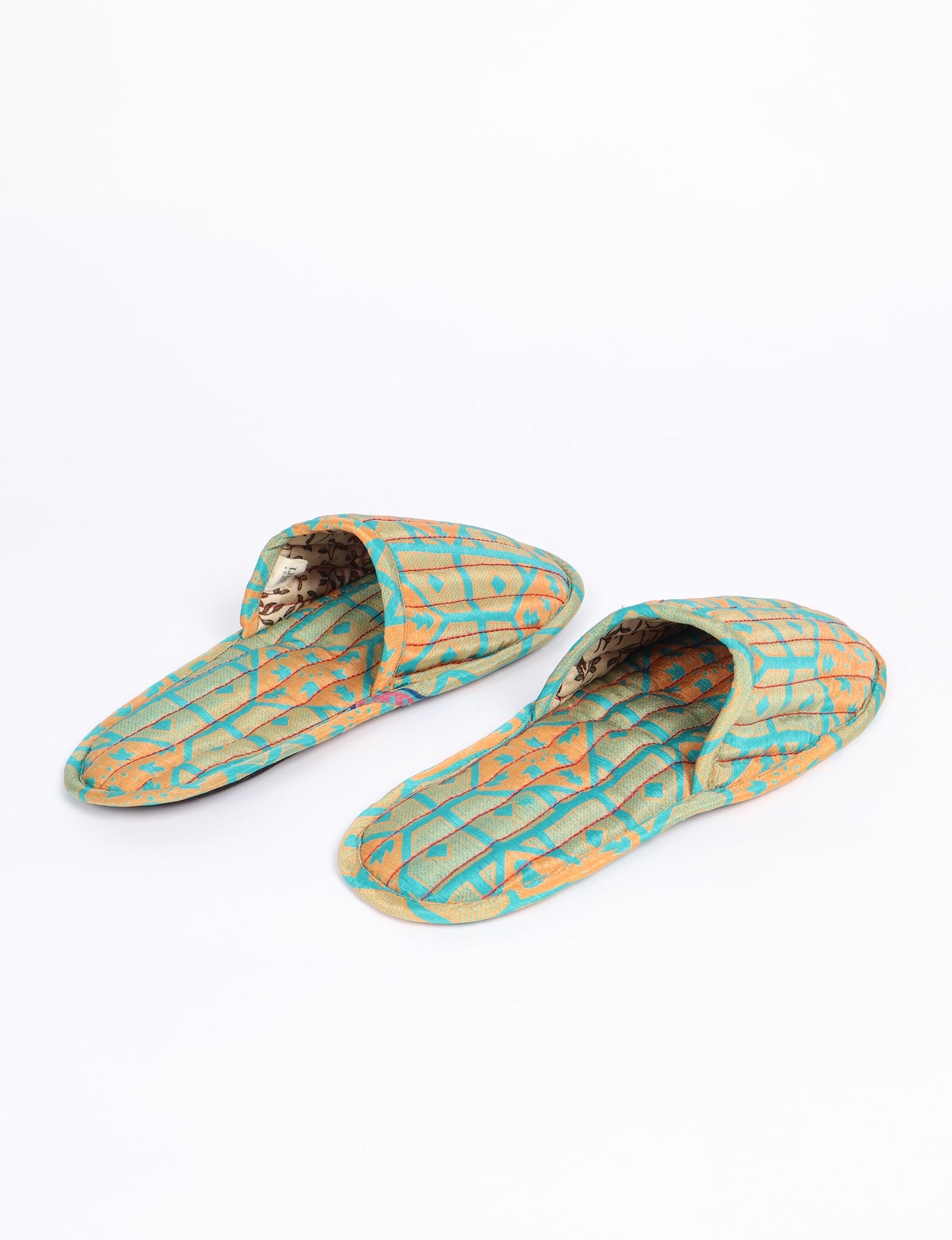 Elevate your downtime with our Quilted Slippers. Ethical, sustainable, and crafted by female artisans in Mumbai, these slippers offer cushioned comfort with a touch of chic style. Warm on the inside, fashionable on the outside, step into sustainable luxury.