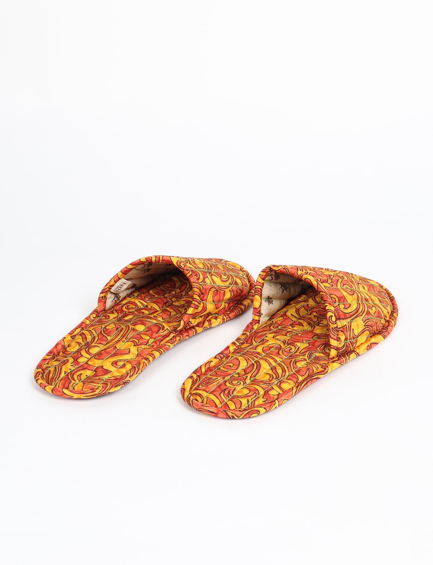 Elevate your downtime with our Quilted Slippers. Ethical, sustainable, and crafted by female artisans in Mumbai, these slippers offer cushioned comfort with a touch of chic style. Warm on the inside, fashionable on the outside, step into sustainable luxury.
