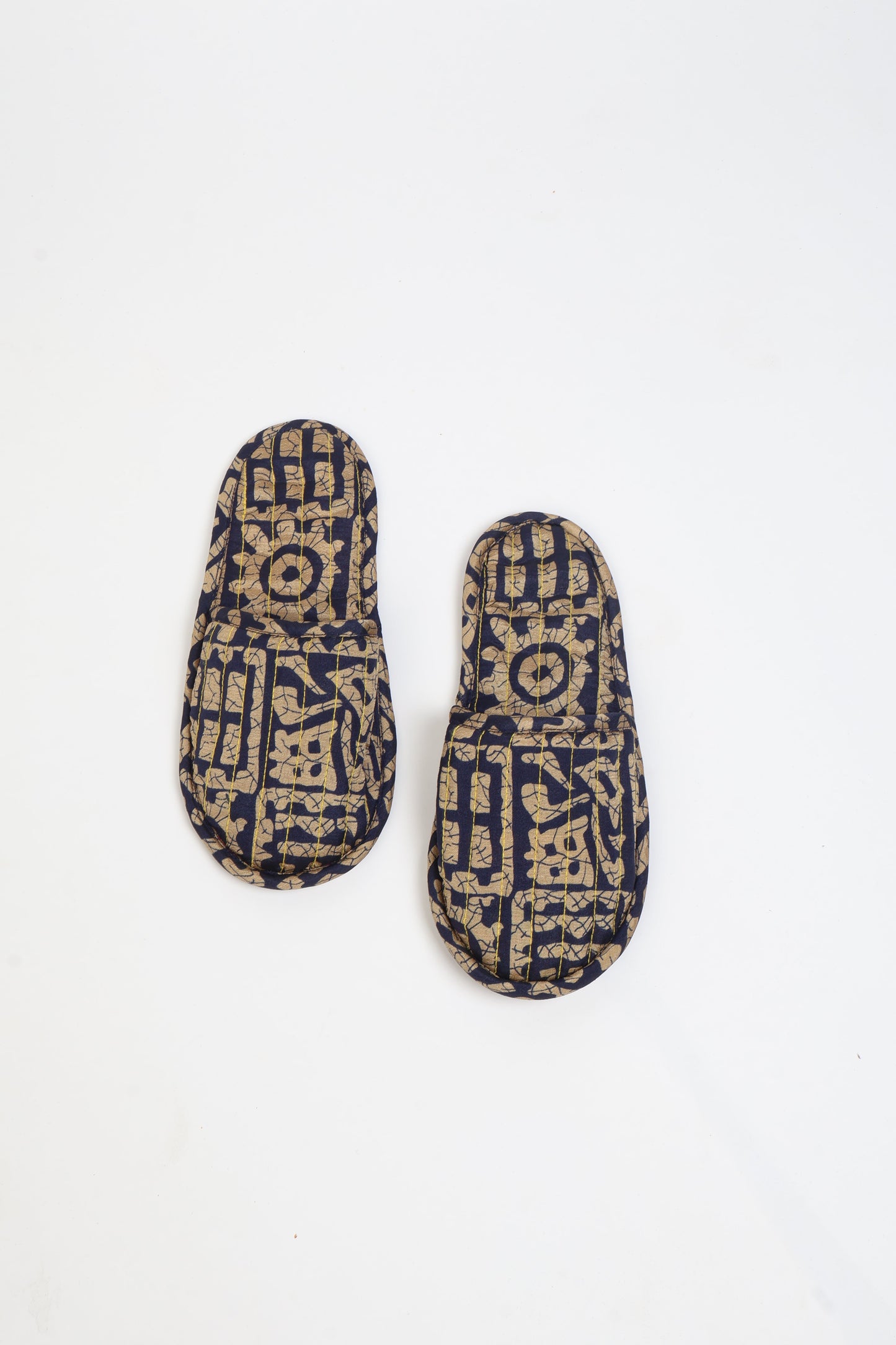 Elevate your downtime with our Quilted Slippers. Ethical, sustainable, and crafted by female artisans in Mumbai, these slippers offer cushioned comfort with a touch of chic style. Warm on the inside, fashionable on the outside, step into sustainable luxury.