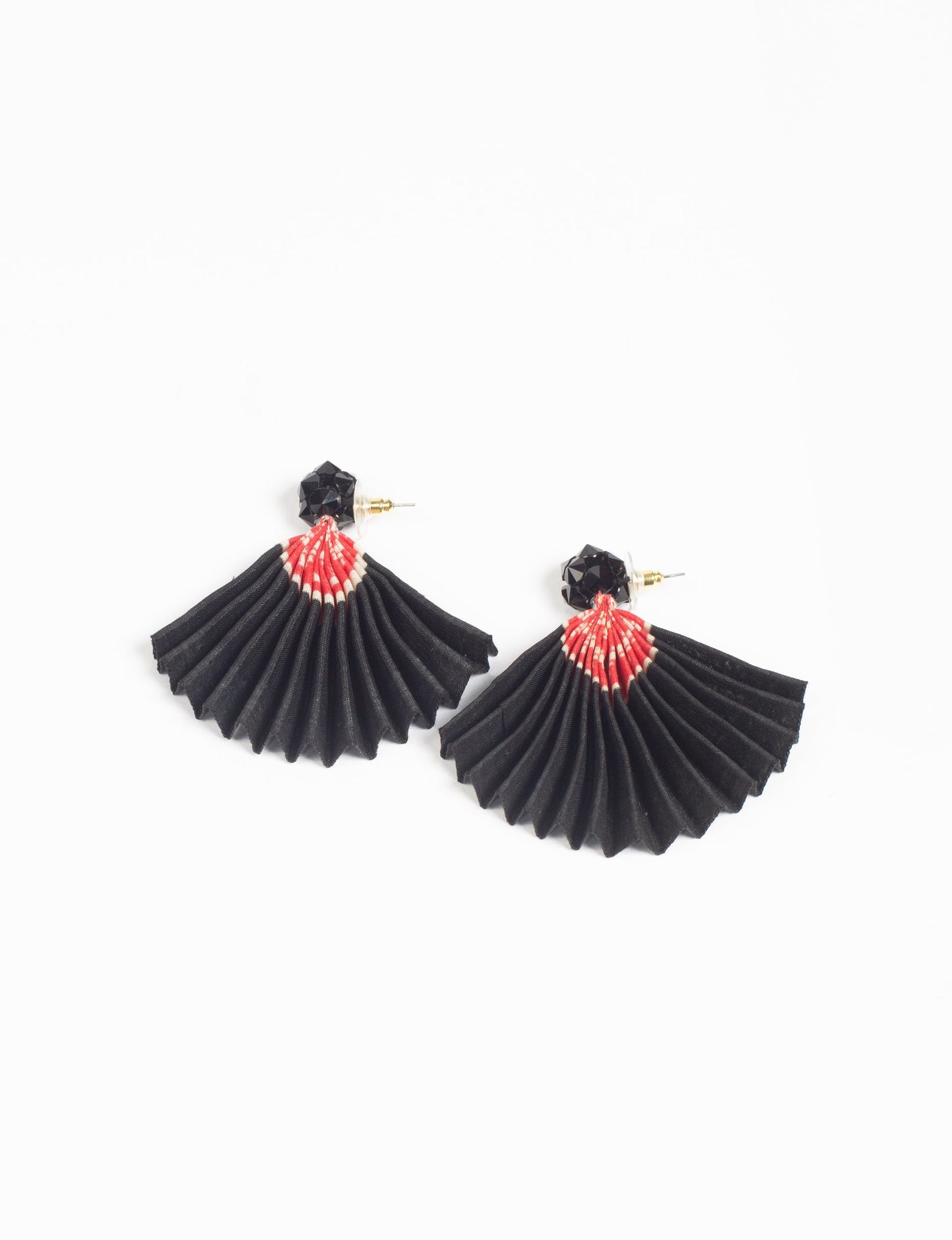 Elevate your style sustainably with our PLEATED EARRINGS – a harmonious blend of ethical fashion and eco-conscious design. Fashioned using innovative heat setting techniques on pre-loved Indian saris, these accessories showcase a commitment to slow fashion and upcycled fashion. Enjoy planet-friendly charm with hypoallergy tested metal hooks, nickel, and lead-free for a skin-friendly touch.