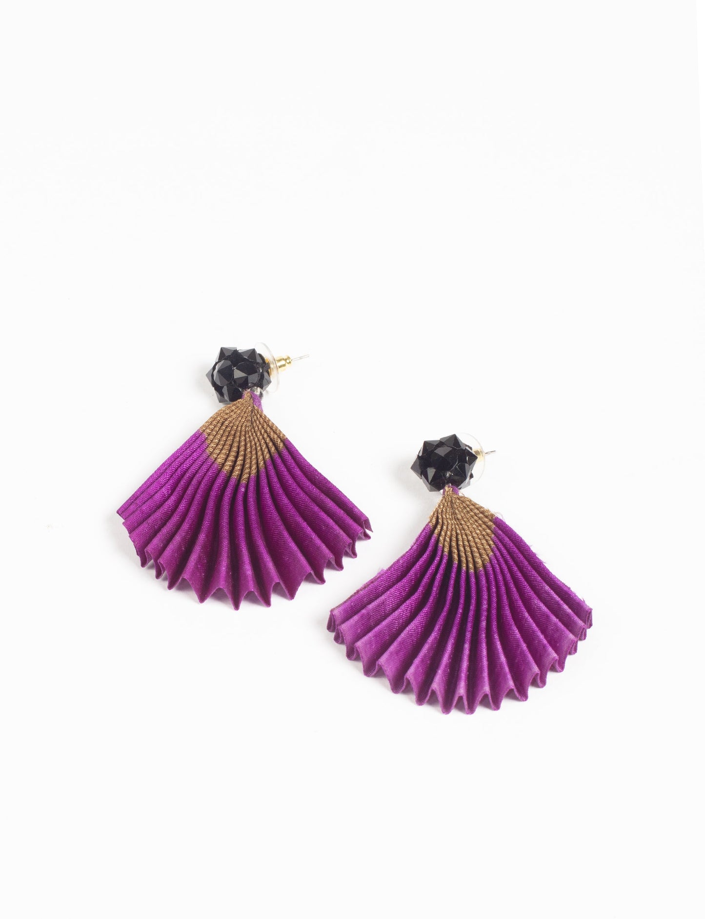 Elevate your style sustainably with our PLEATED EARRINGS – a harmonious blend of ethical fashion and eco-conscious design. Fashioned using innovative heat setting techniques on pre-loved Indian saris, these accessories showcase a commitment to slow fashion and upcycled fashion. Enjoy planet-friendly charm with hypoallergy tested metal hooks, nickel, and lead-free for a skin-friendly touch.