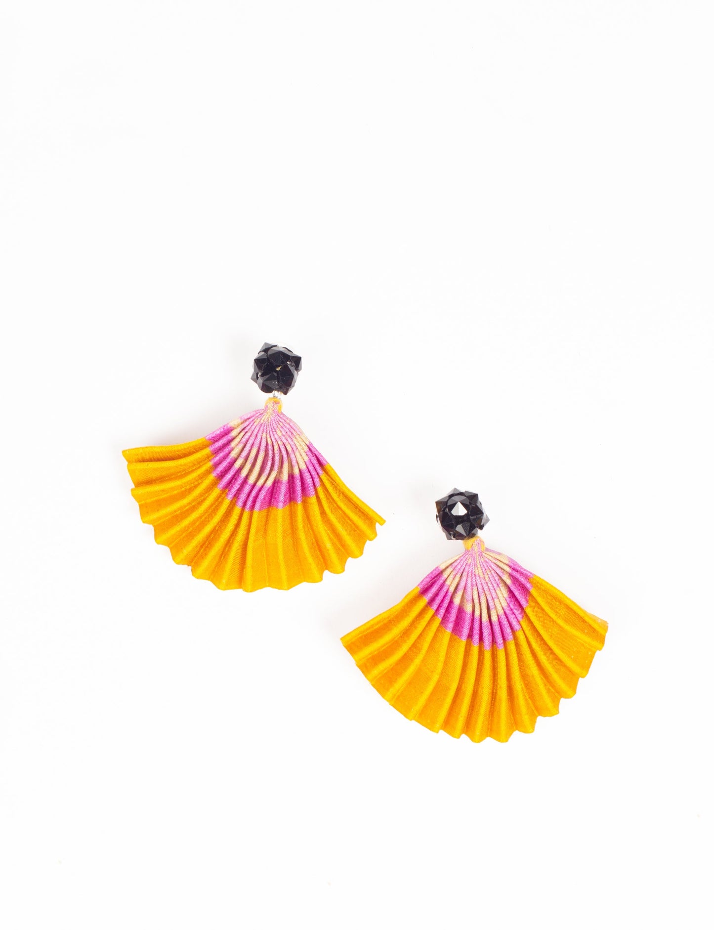 Elevate your style sustainably with our PLEATED EARRINGS – a harmonious blend of ethical fashion and eco-conscious design. Fashioned using innovative heat setting techniques on pre-loved Indian saris, these accessories showcase a commitment to slow fashion and upcycled fashion. Enjoy planet-friendly charm with hypoallergy tested metal hooks, nickel, and lead-free for a skin-friendly touch.