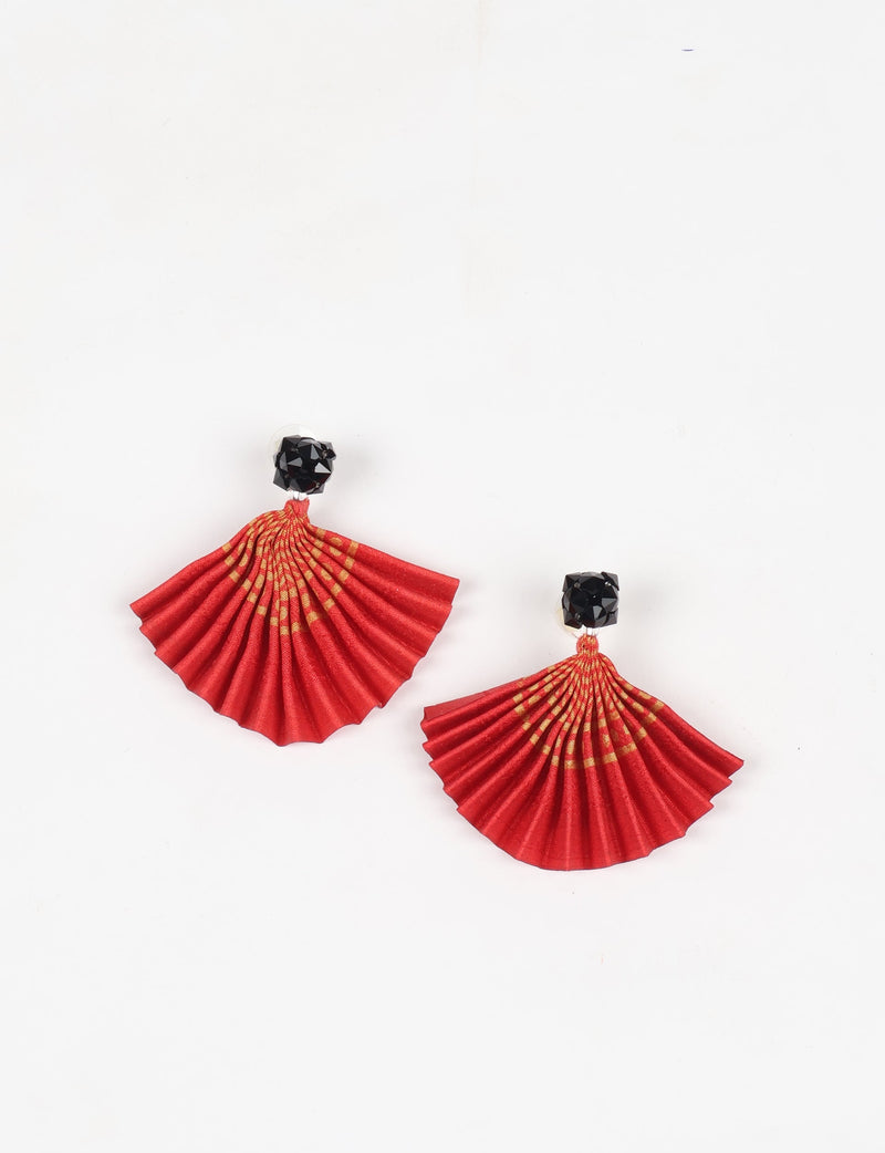 Red pleated fabric earrings with abstract orange pattern and black faceted stud tops, shown flat on white background