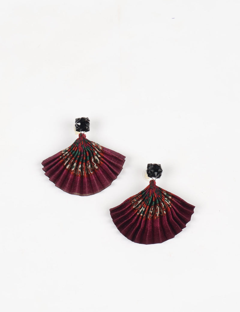 Pleated earrings in red abstract pattern with black faceted stud tops, shown flat on white background