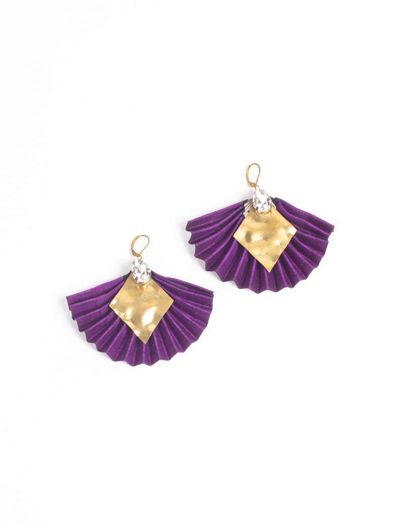 Purple pleated fabric earrings with gold diamond-shaped metal and clear teardrop gem accents, shown flat on white background