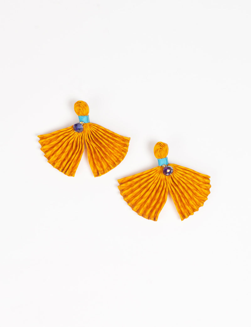 Yellow pleated fabric earrings with blue band and purple gem detail, shown flat on white background