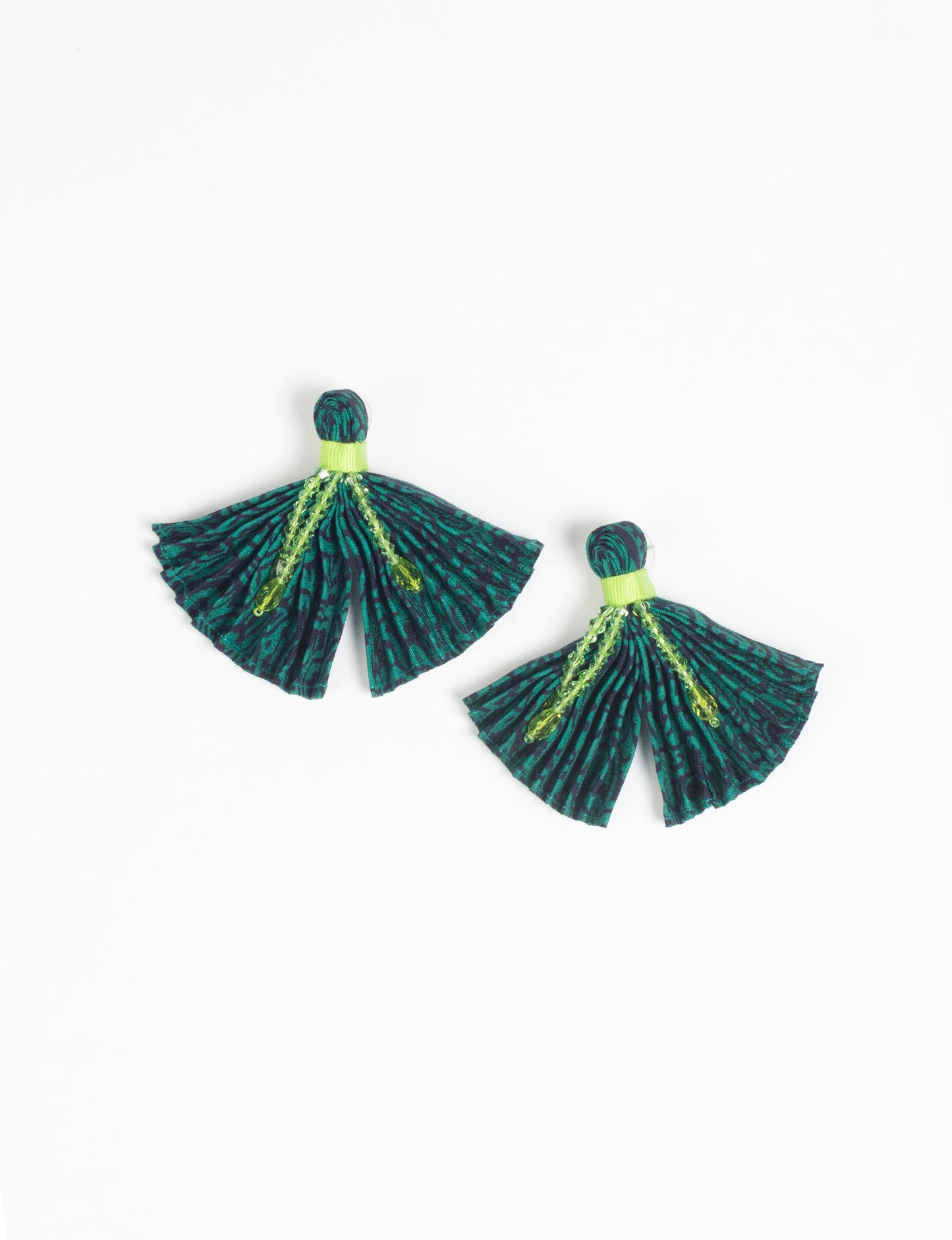 Elevate your look with our PLEATED EARRINGS – embellished with a beaded dangler, diamond-shaped metallic plate, and hook fastening. Crafted with innovative heat setting techniques on pre-loved saris, these earrings showcase ethical clothing, green fashion, and zero waste fashion. Hypoallergy tested metal hooks, nickel, and lead-free for a conscious and stylish accessory.