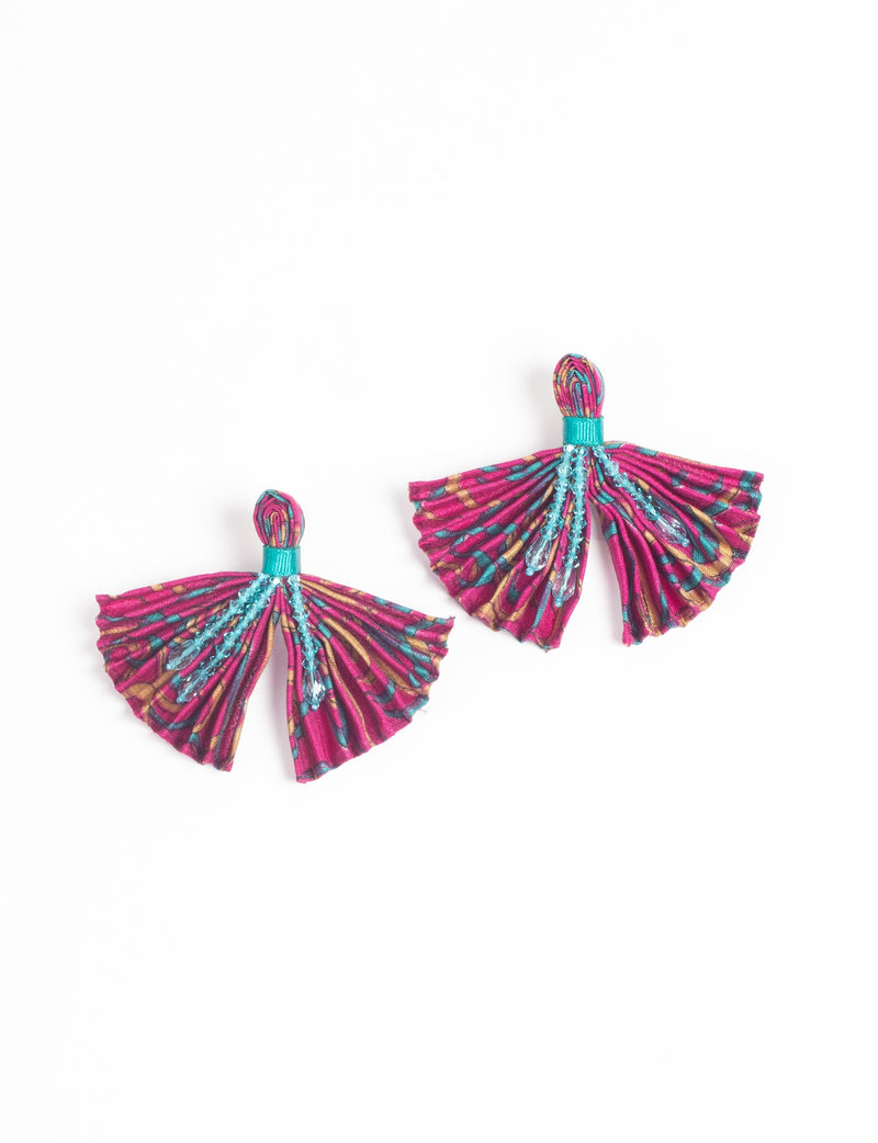Pink pleated fabric earrings with abstract multicolor pattern and turquoise bead accents, shown flat on white background