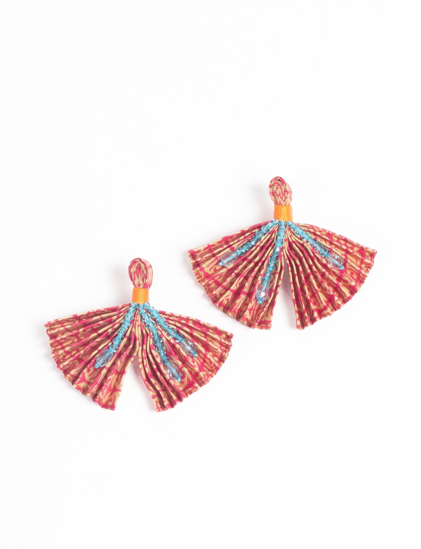 Elevate your look with our PLEATED EARRINGS – embellished with a beaded dangler, diamond-shaped metallic plate, and hook fastening. Crafted with innovative heat setting techniques on pre-loved saris, these earrings showcase ethical clothing, green fashion, and zero waste fashion. Hypoallergy tested metal hooks, nickel, and lead-free for a conscious and stylish accessory.