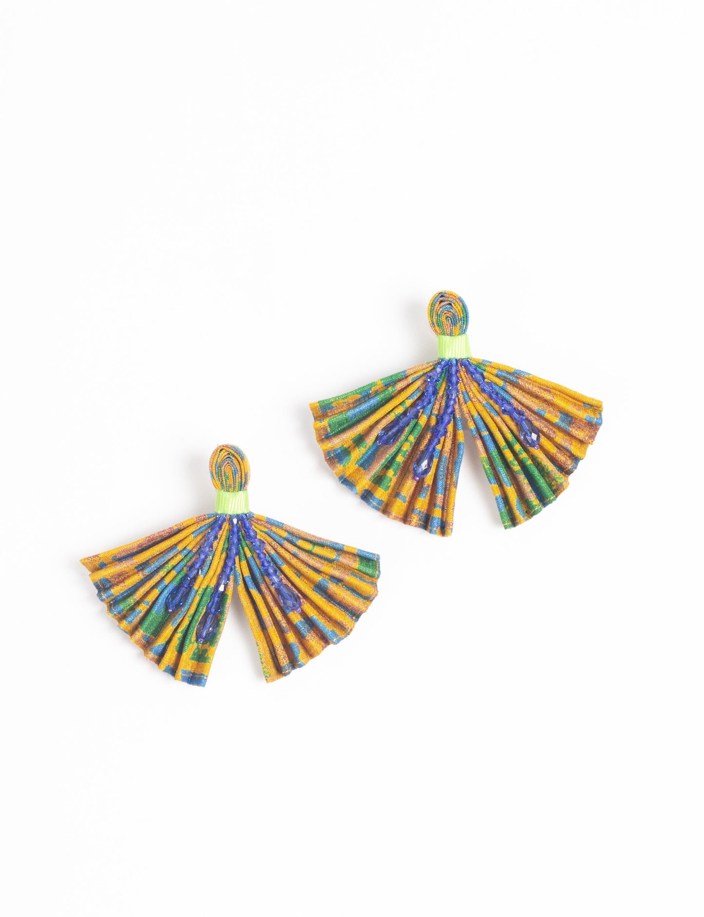 Elevate your look with our PLEATED EARRINGS – embellished with a beaded dangler, diamond-shaped metallic plate, and hook fastening. Crafted with innovative heat setting techniques on pre-loved saris, these earrings showcase ethical clothing, green fashion, and zero waste fashion. Hypoallergy tested metal hooks, nickel, and lead-free for a conscious and stylish accessory.