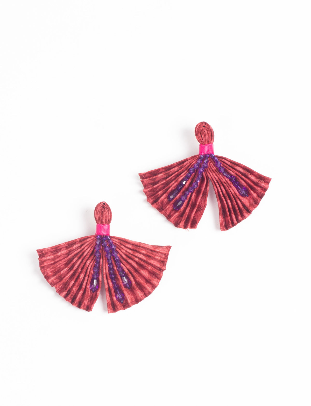 Red pleated fabric earrings with purple bead embellishments and pink thread detail, shown flat on white background