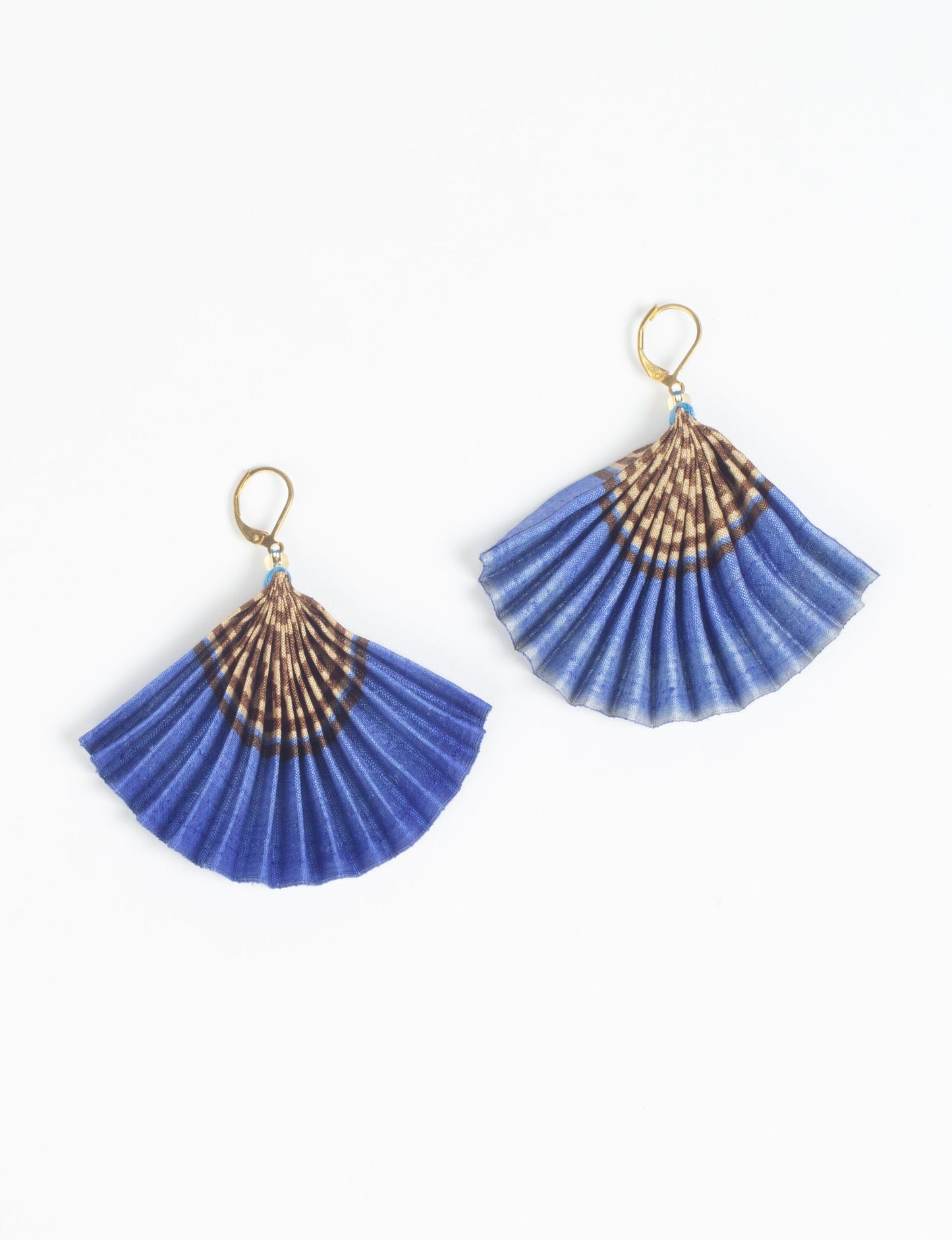 Elevate your style sustainably with our PLEATED EARRINGS – a timeless creation from pre-loved Indian saris, crafted using innovative heat setting techniques. Align with ethical clothing, green fashion, and slow fashion, these earrings are a statement of mindful elegance. Hypoallergy tested metal hooks make them a skin-friendly, sustainable choice.