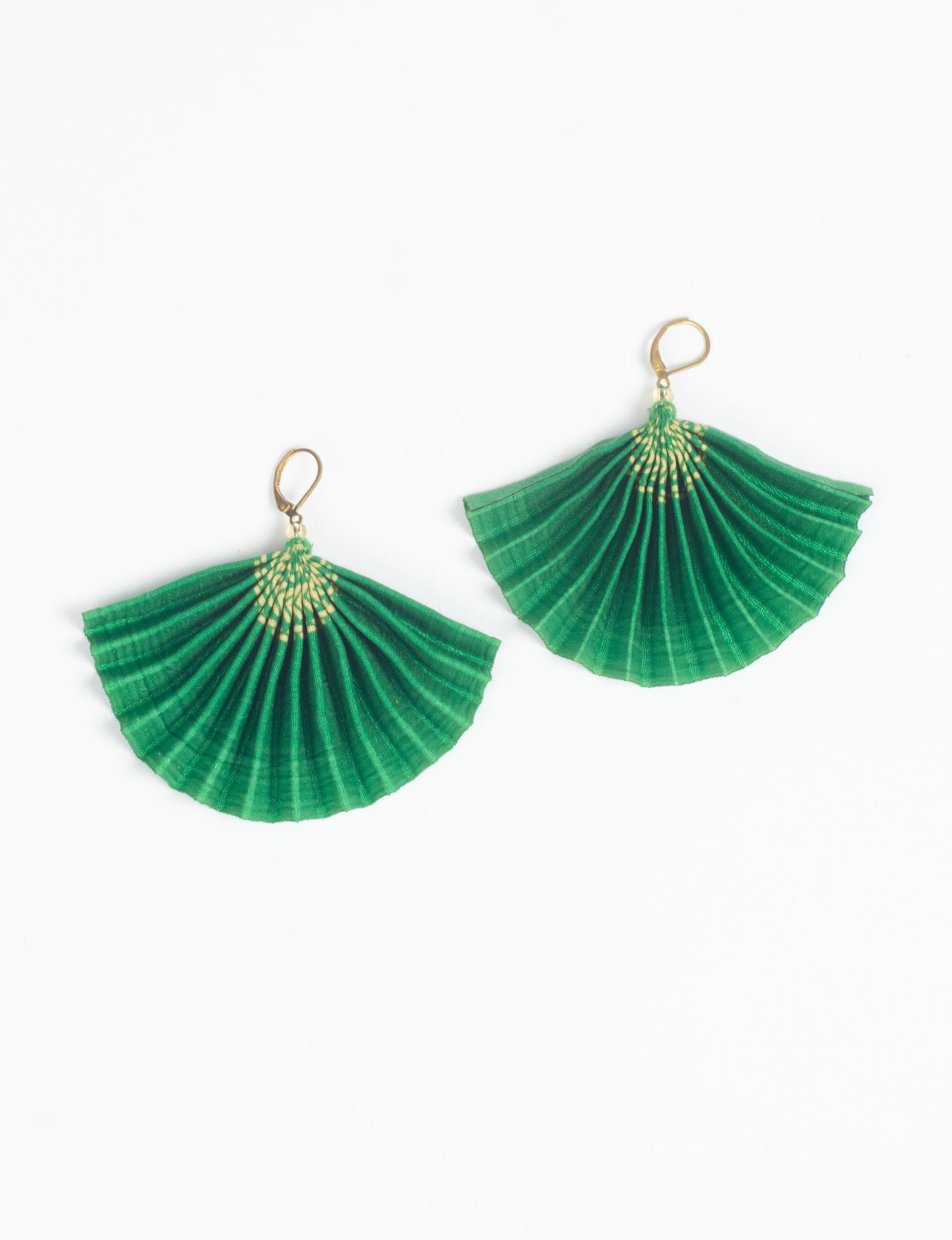 Elevate your style sustainably with our PLEATED EARRINGS – a timeless creation from pre-loved Indian saris, crafted using innovative heat setting techniques. Align with ethical clothing, green fashion, and slow fashion, these earrings are a statement of mindful elegance. Hypoallergy tested metal hooks make them a skin-friendly, sustainable choice.