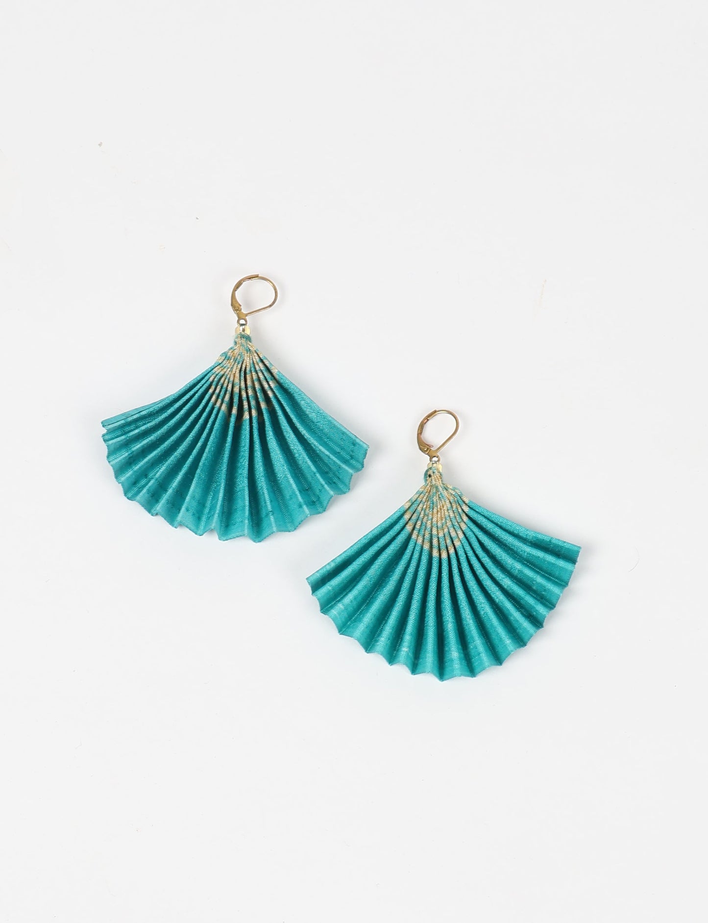 Elevate your style sustainably with our PLEATED EARRINGS – a timeless creation from pre-loved Indian saris, crafted using innovative heat setting techniques. Align with ethical clothing, green fashion, and slow fashion, these earrings are a statement of mindful elegance. Hypoallergy tested metal hooks make them a skin-friendly, sustainable choice.
