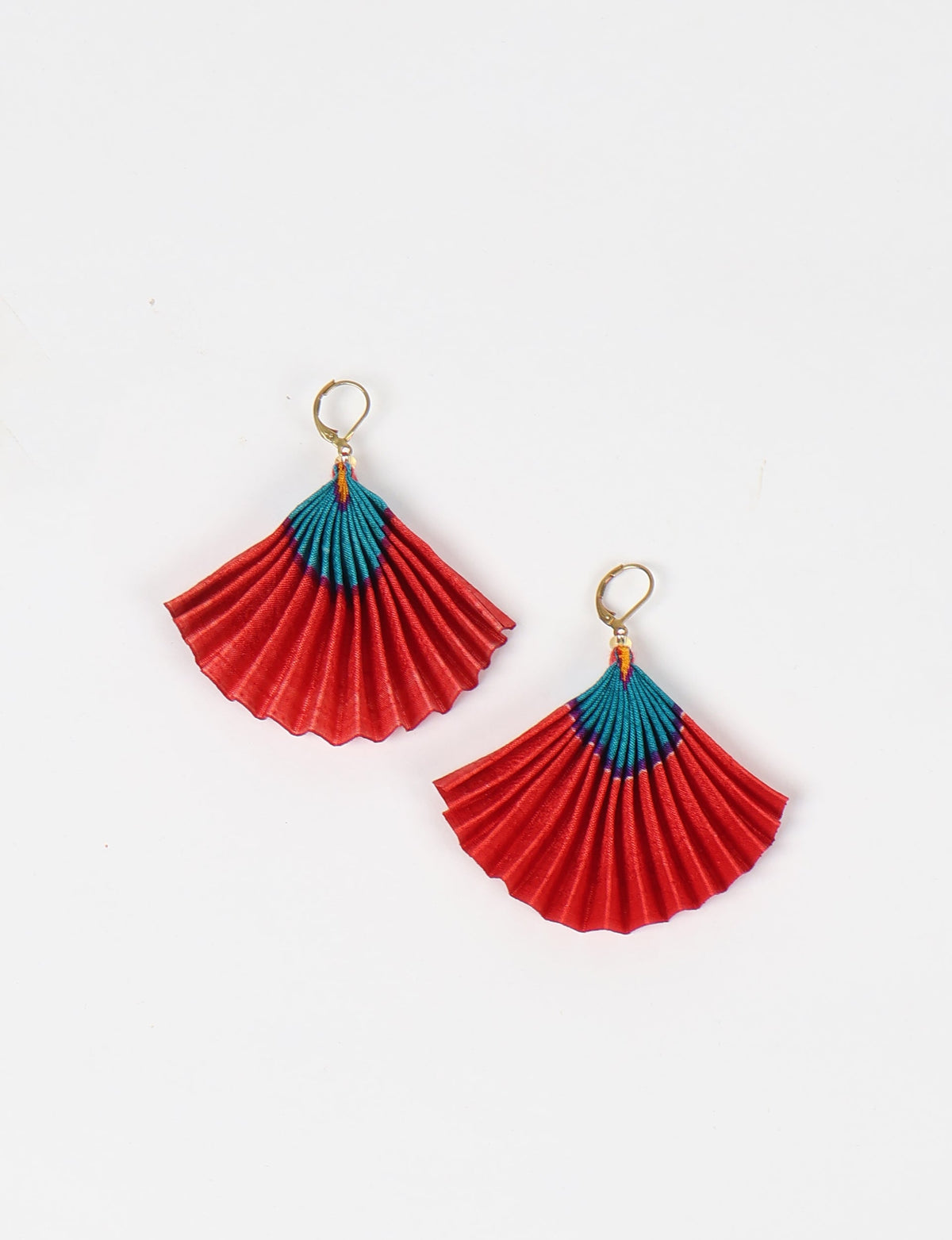 Elevate your style sustainably with our PLEATED EARRINGS – a timeless creation from pre-loved Indian saris, crafted using innovative heat setting techniques. Align with ethical clothing, green fashion, and slow fashion, these earrings are a statement of mindful elegance. Hypoallergy tested metal hooks make them a skin-friendly, sustainable choice.