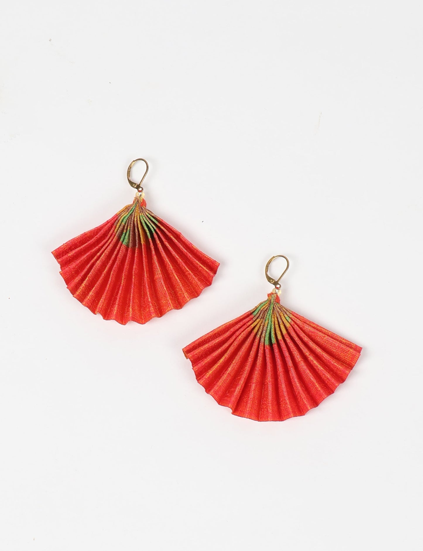 Elevate your style sustainably with our PLEATED EARRINGS – a timeless creation from pre-loved Indian saris, crafted using innovative heat setting techniques. Align with ethical clothing, green fashion, and slow fashion, these earrings are a statement of mindful elegance. Hypoallergy tested metal hooks make them a skin-friendly, sustainable choice.