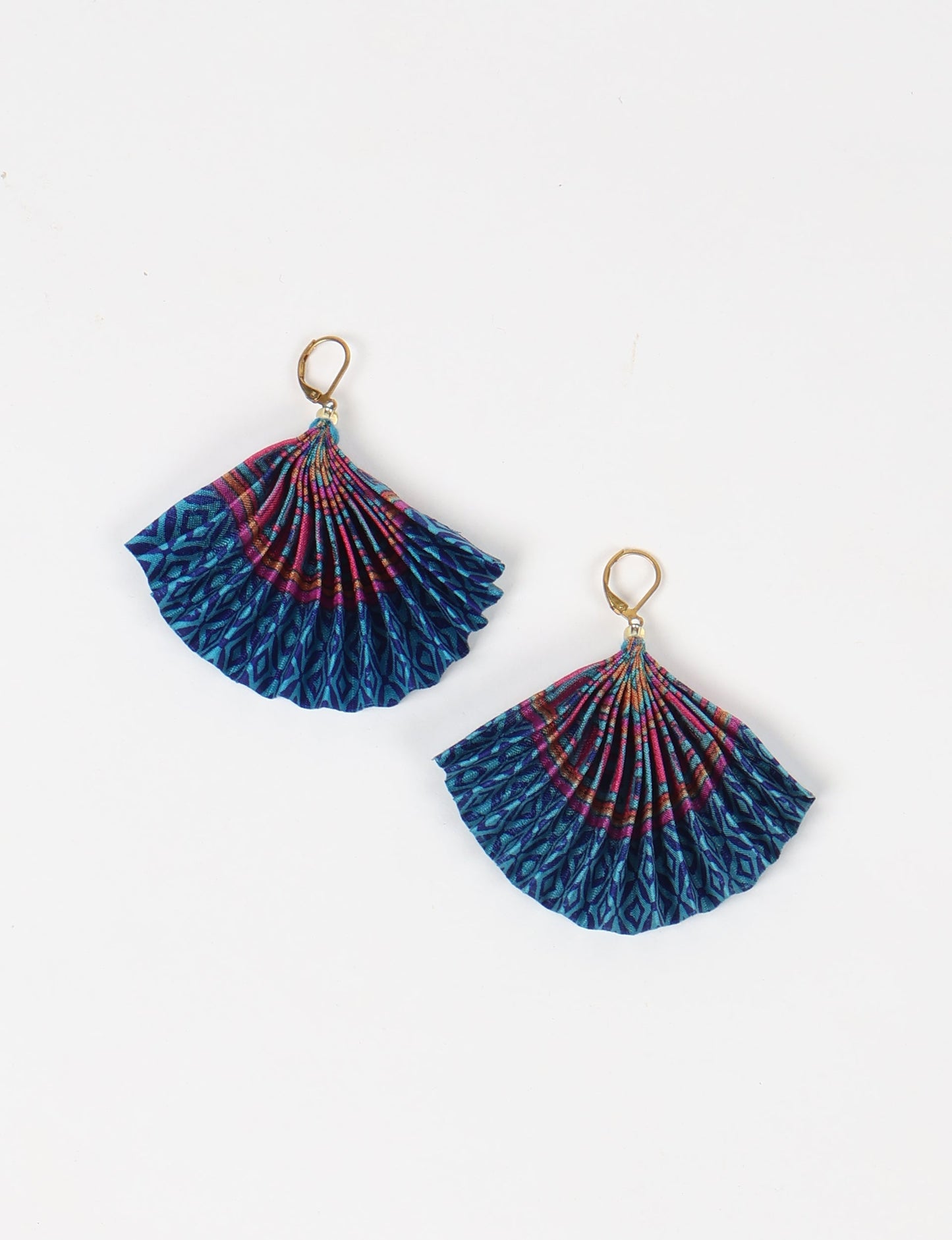 Elevate your style sustainably with our PLEATED EARRINGS – a timeless creation from pre-loved Indian saris, crafted using innovative heat setting techniques. Align with ethical clothing, green fashion, and slow fashion, these earrings are a statement of mindful elegance. Hypoallergy tested metal hooks make them a skin-friendly, sustainable choice.