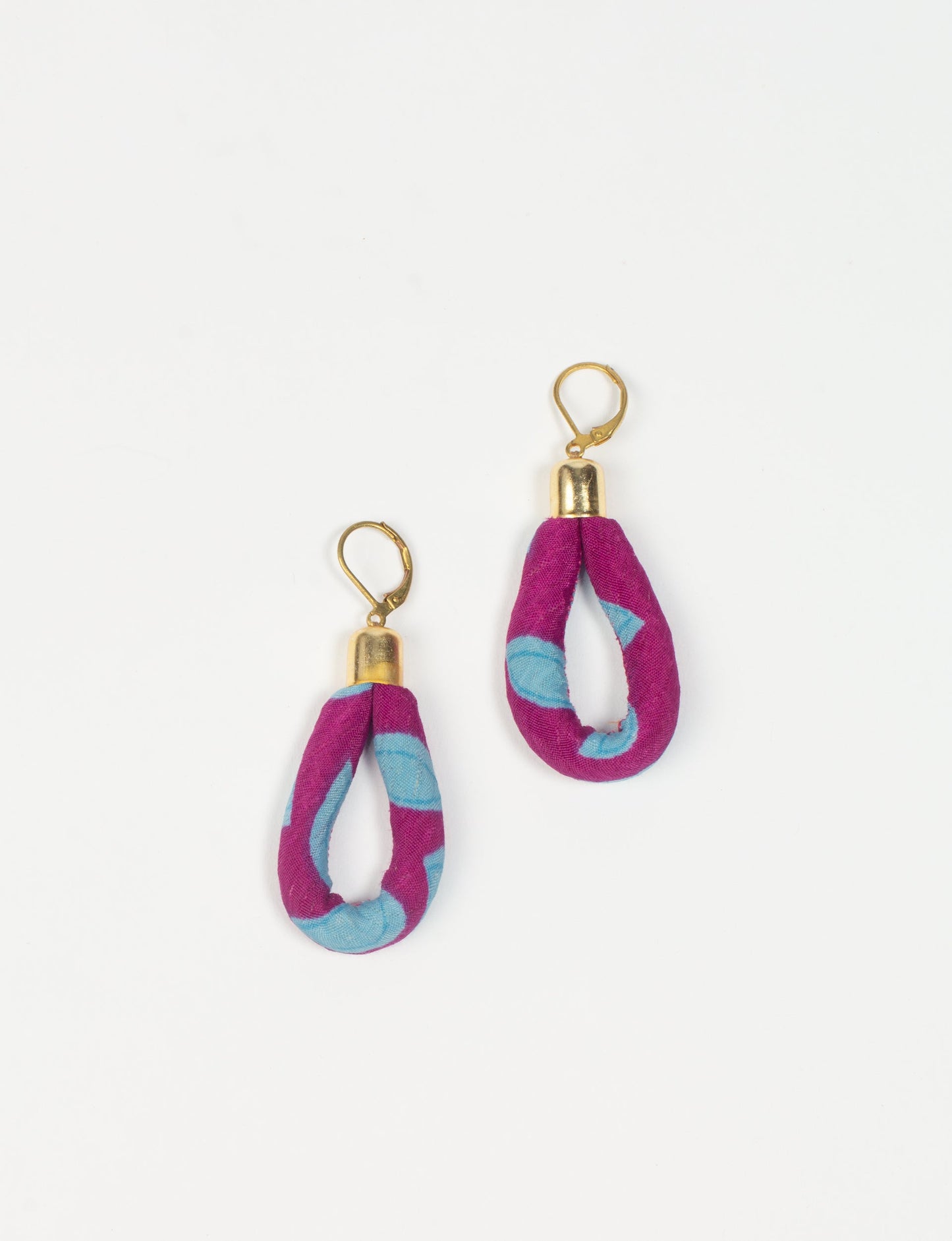 Elevate your style sustainably with our Rope Earrings. Crafted from cotton rope hand-wrapped with pre-loved saris, these earrings are a testament to ethical and green fashion. Make a conscious choice for a brighter, eco-friendly future.