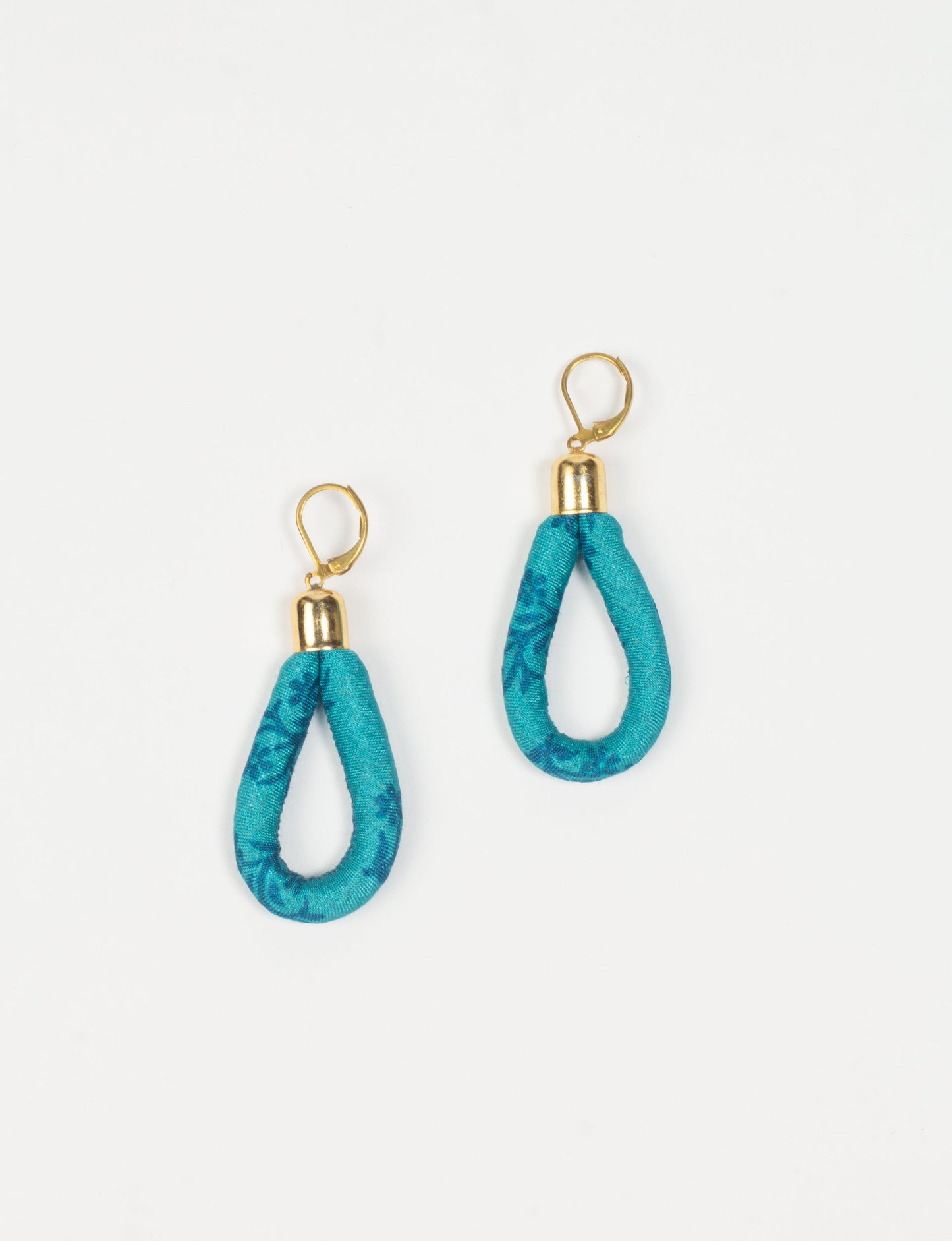 Elevate your style sustainably with our Rope Earrings. Crafted from cotton rope hand-wrapped with pre-loved saris, these earrings are a testament to ethical and green fashion. Make a conscious choice for a brighter, eco-friendly future.