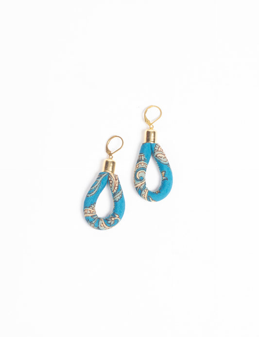 Elevate your style sustainably with our Rope Earrings. Crafted from cotton rope hand-wrapped with pre-loved saris, these earrings are a testament to ethical and green fashion. Make a conscious choice for a brighter, eco-friendly future.