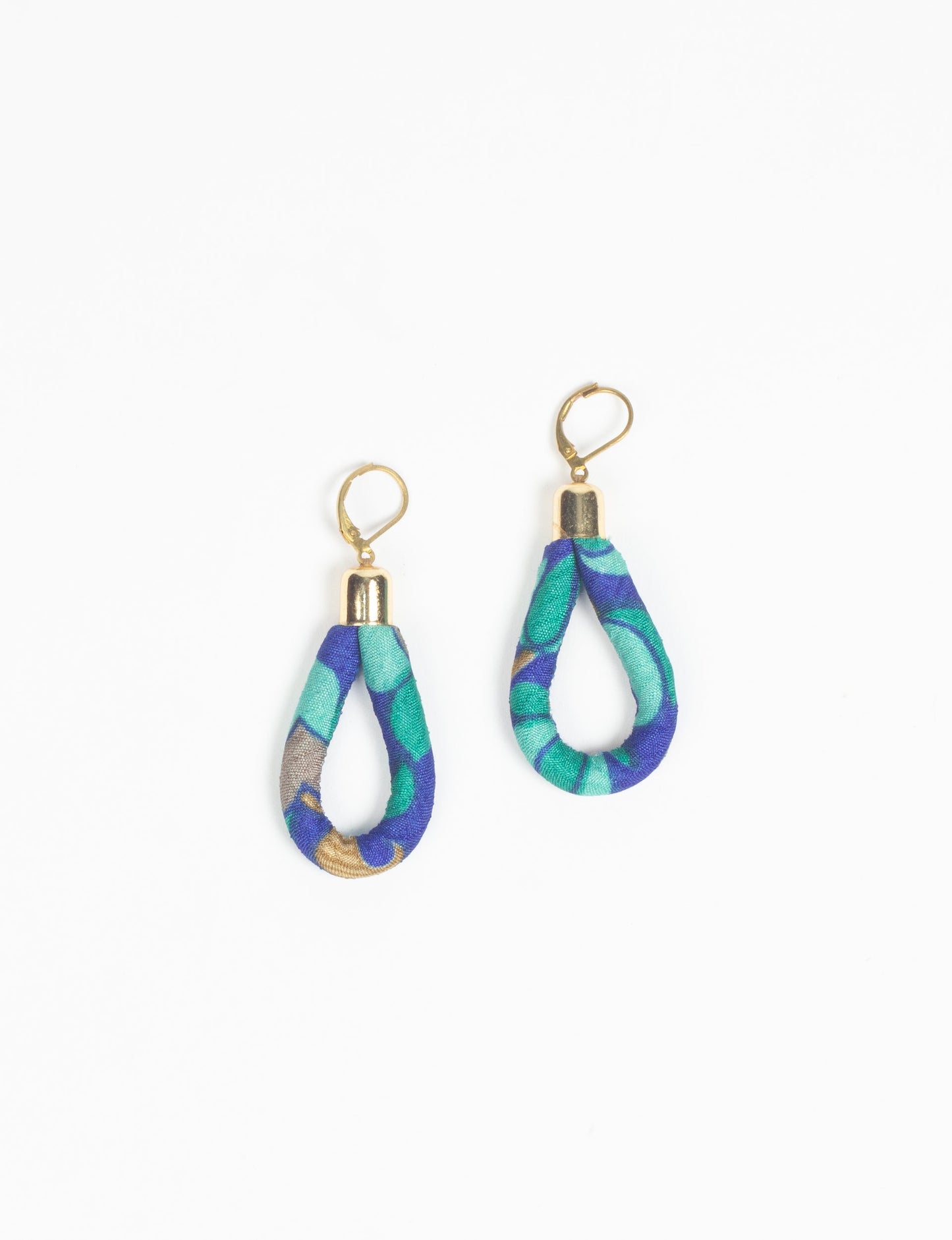 Elevate your style sustainably with our Rope Earrings. Crafted from cotton rope hand-wrapped with pre-loved saris, these earrings are a testament to ethical and green fashion. Make a conscious choice for a brighter, eco-friendly future.