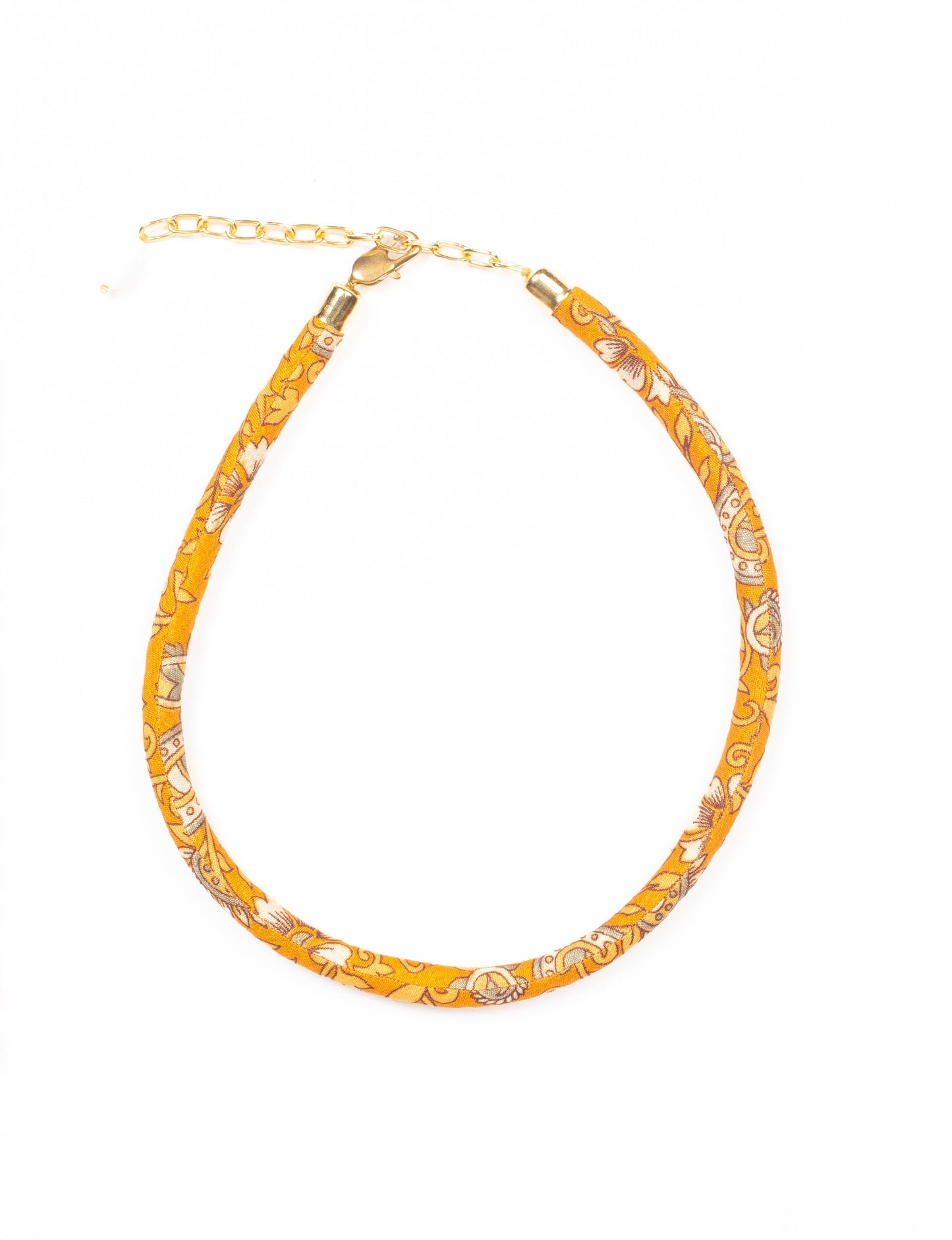 Elevate your look sustainably with our Rope Necklace. Crafted using cotton rope hand-wrapped with pre-loved Indian saris, this necklace is a testament to ethical and green fashion. Make a conscious choice for a brighter, eco-friendly future with this unique, upcycled accessory.