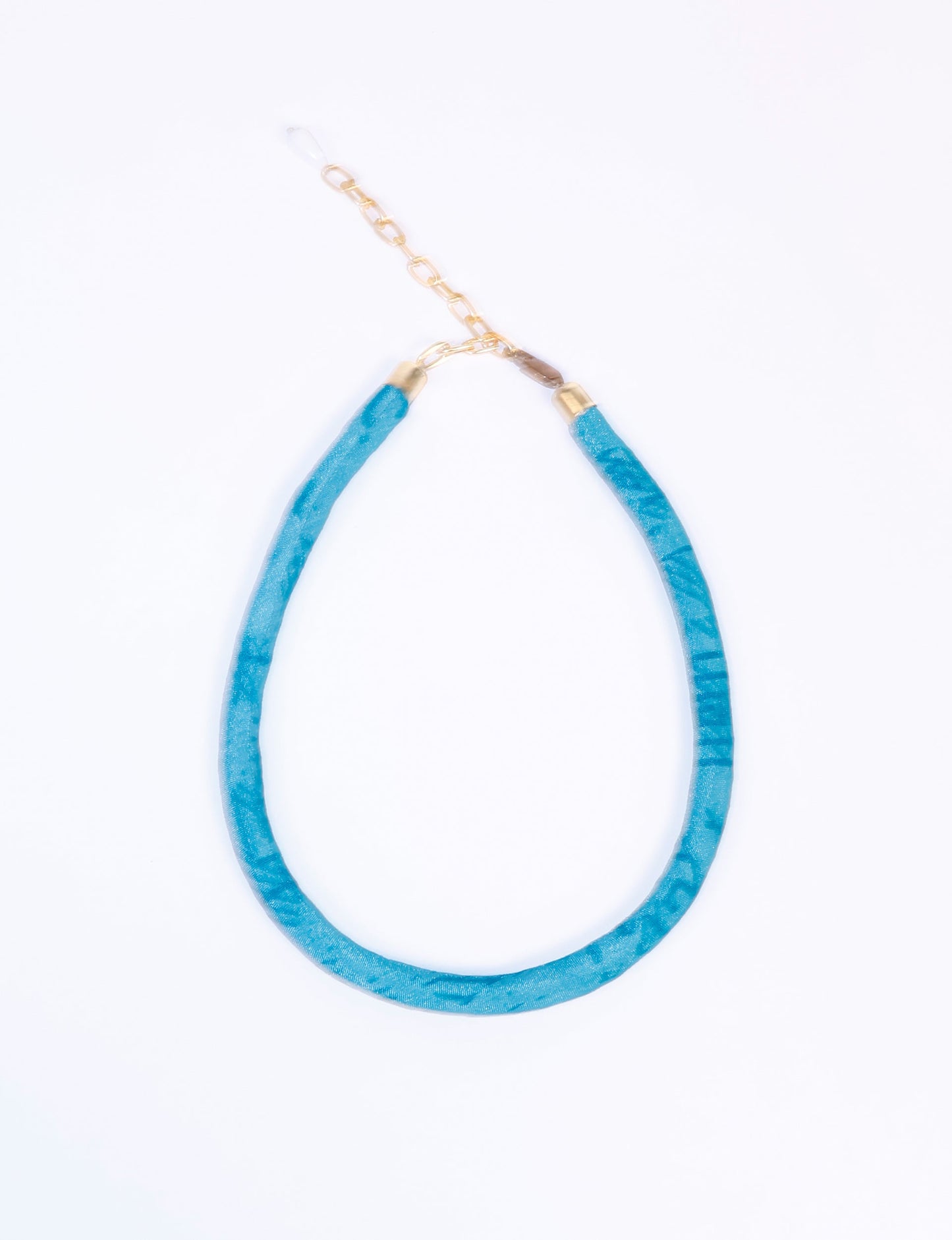 Elevate your look sustainably with our Rope Necklace. Crafted using cotton rope hand-wrapped with pre-loved Indian saris, this necklace is a testament to ethical and green fashion. Make a conscious choice for a brighter, eco-friendly future with this unique, upcycled accessory.