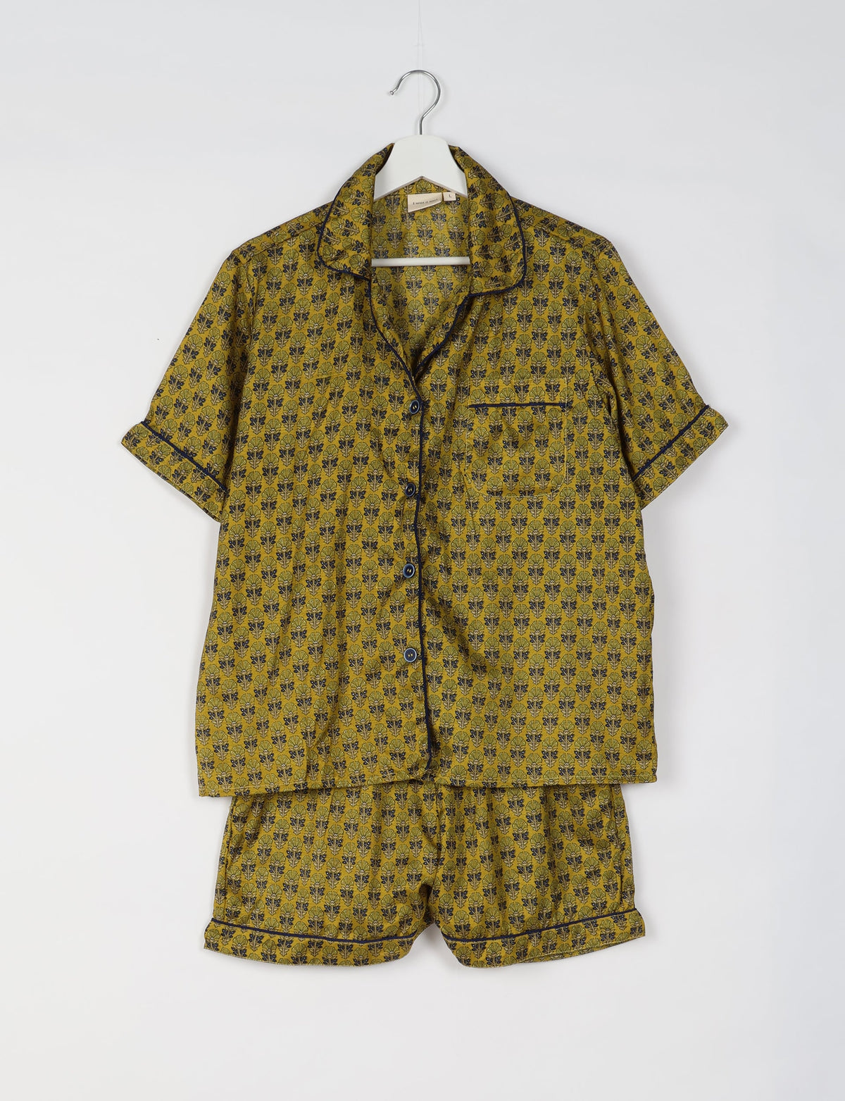 Indulge in comfort and style with our PJ Set Short, now with short sleeves. Crafted from upcycled saris, these shorts embody a zero-waste mentality for sustainable sleepwear. Versatile from day to night, perfect for beach lounging or poolside yoga, these pajamas redefine conscious fashion.