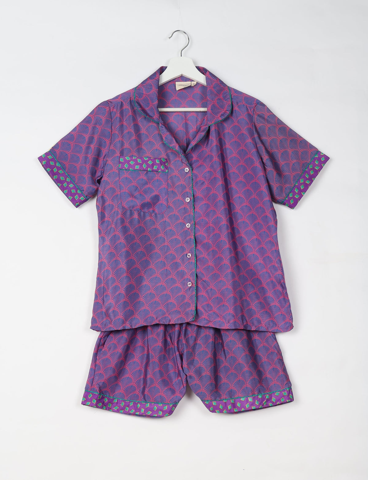 Indulge in comfort and style with our PJ Set Short, now with short sleeves. Crafted from upcycled saris, these shorts embody a zero-waste mentality for sustainable sleepwear. Versatile from day to night, perfect for beach lounging or poolside yoga, these pajamas redefine conscious fashion.