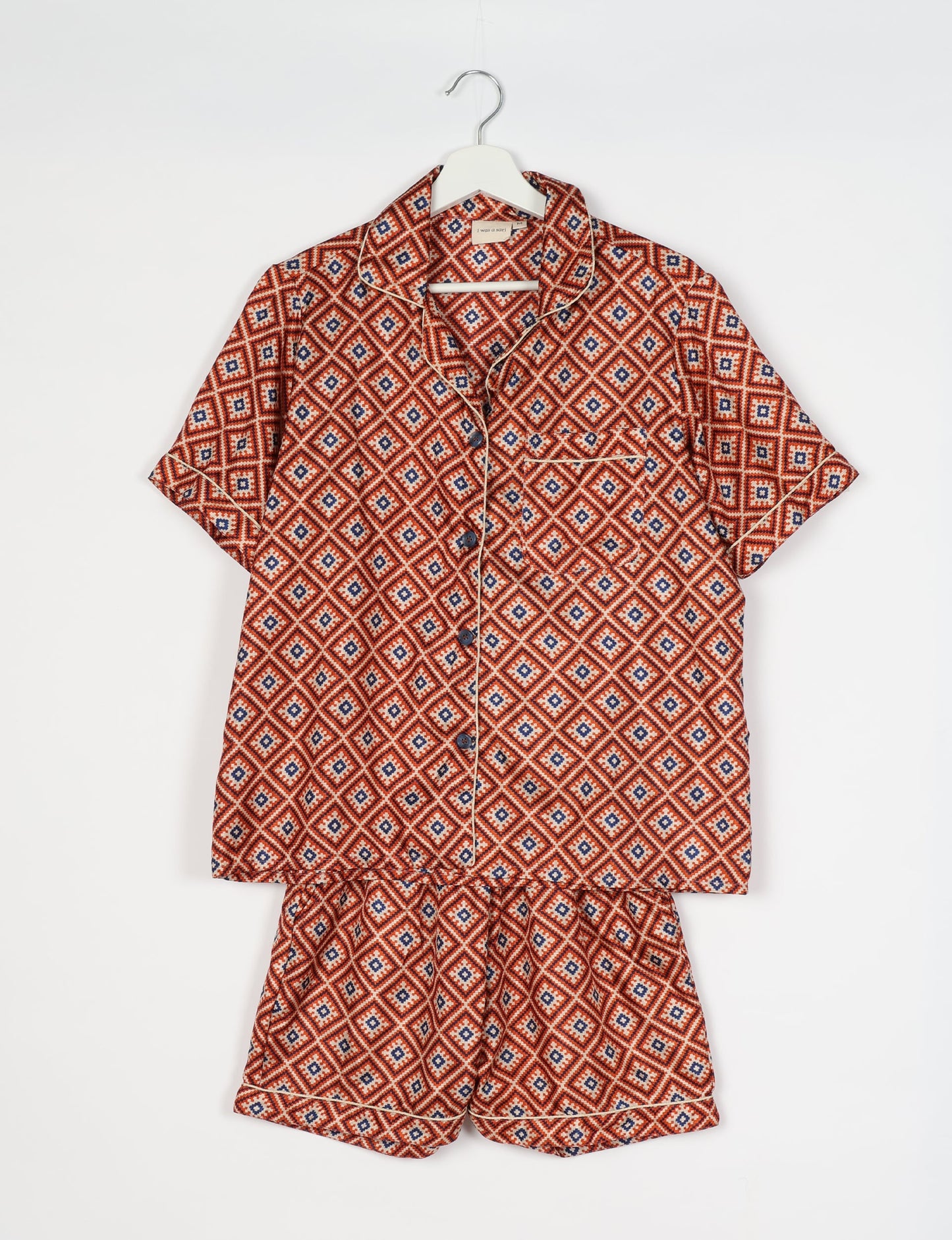 Indulge in comfort and style with our PJ Set Short, now with short sleeves. Crafted from upcycled saris, these shorts embody a zero-waste mentality for sustainable sleepwear. Versatile from day to night, perfect for beach lounging or poolside yoga, these pajamas redefine conscious fashion.