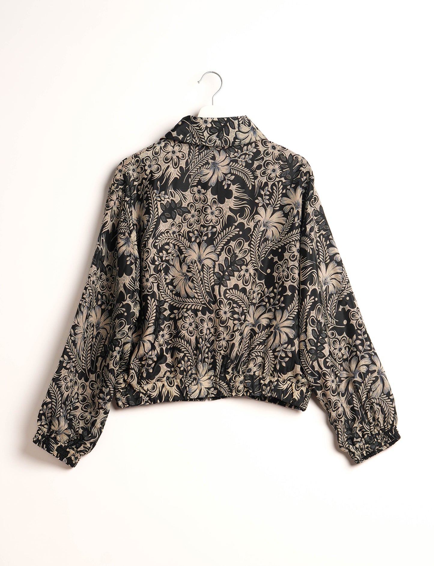 Stylish BOMBER JACKET, an upcycled clothing masterpiece with a cute cropped shape, elasticated details, and detachable metallic zipper. Contrast sari print lining adds a unique touch. Explore sustainable and eco-friendly fashion.