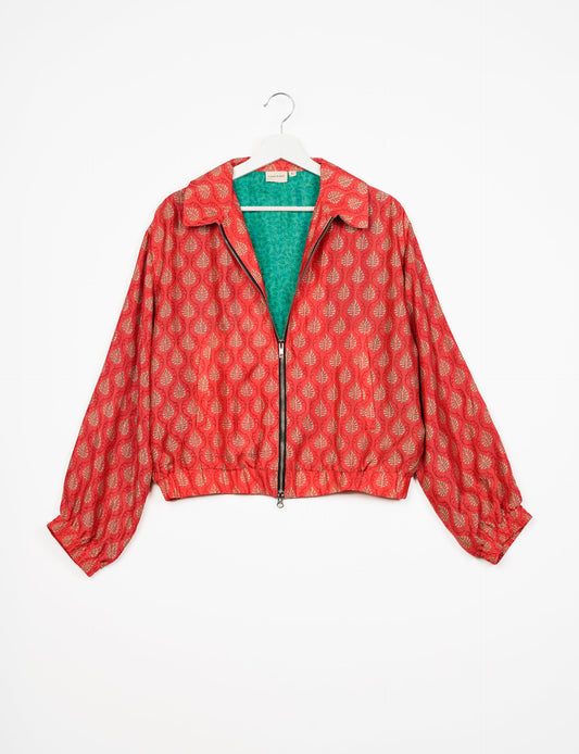 Stylish BOMBER JACKET, an upcycled clothing masterpiece with a cute cropped shape, elasticated details, and detachable metallic zipper. Contrast sari print lining adds a unique touch. Explore sustainable and eco-friendly fashion.