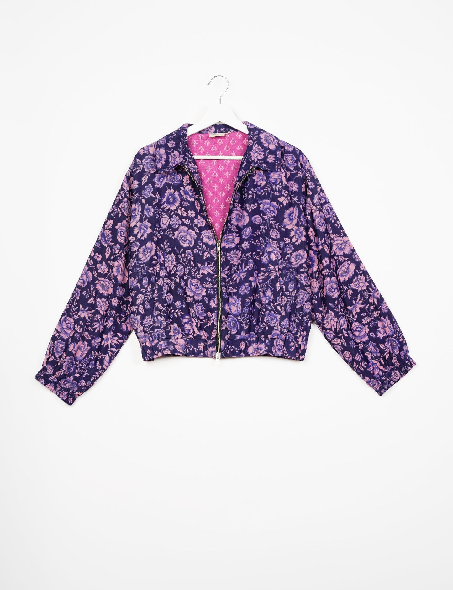 Stylish BOMBER JACKET, an upcycled clothing masterpiece with a cute cropped shape, elasticated details, and detachable metallic zipper. Contrast sari print lining adds a unique touch. Explore sustainable and eco-friendly fashion.