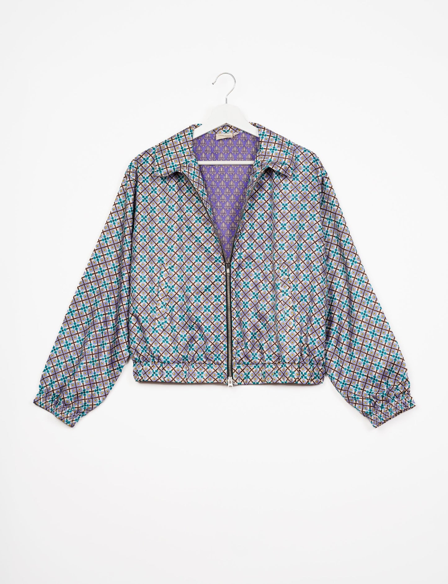 Stylish BOMBER JACKET, an upcycled clothing masterpiece with a cute cropped shape, elasticated details, and detachable metallic zipper. Contrast sari print lining adds a unique touch. Explore sustainable and eco-friendly fashion.