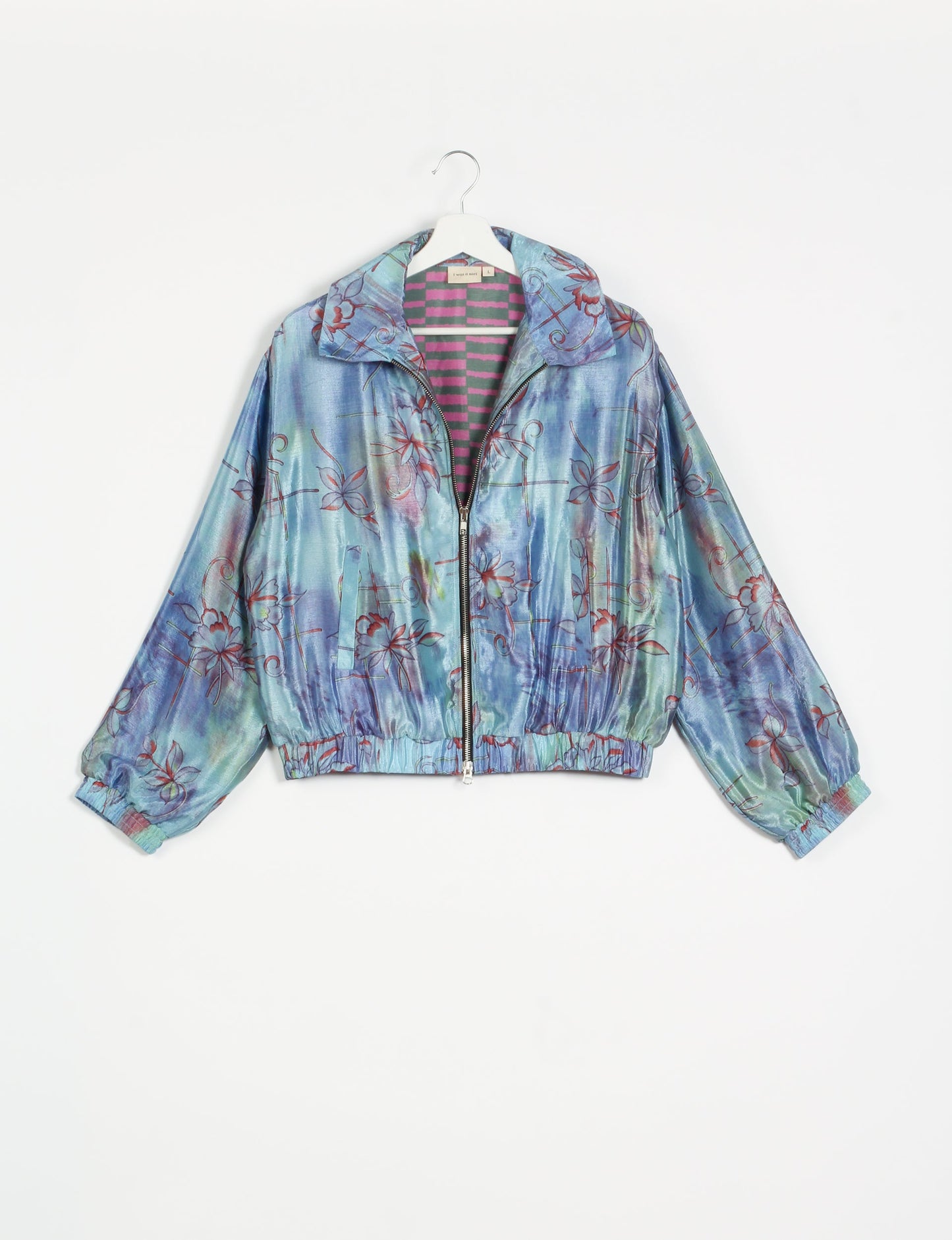 Stylish BOMBER JACKET, an upcycled clothing masterpiece with a cute cropped shape, elasticated details, and detachable metallic zipper. Contrast sari print lining adds a unique touch. Explore sustainable and eco-friendly fashion.