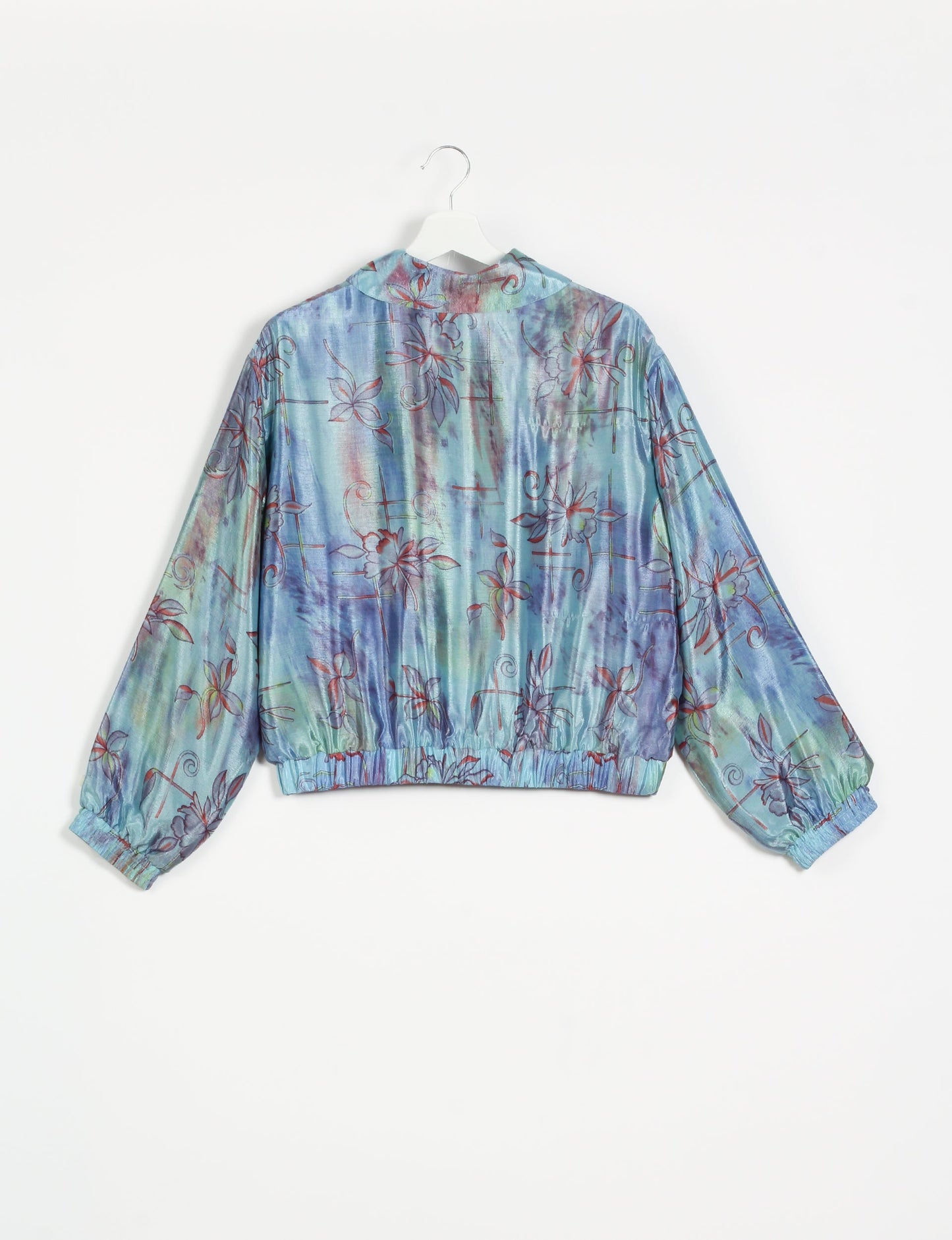 Stylish BOMBER JACKET, an upcycled clothing masterpiece with a cute cropped shape, elasticated details, and detachable metallic zipper. Contrast sari print lining adds a unique touch. Explore sustainable and eco-friendly fashion.