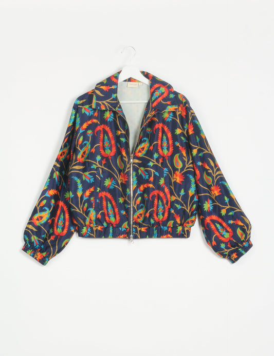 Stylish BOMBER JACKET, an upcycled clothing masterpiece with a cute cropped shape, elasticated details, and detachable metallic zipper. Contrast sari print lining adds a unique touch. Explore sustainable and eco-friendly fashion.