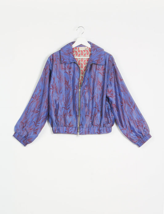 Stylish BOMBER JACKET, an upcycled clothing masterpiece with a cute cropped shape, elasticated details, and detachable metallic zipper. Contrast sari print lining adds a unique touch. Explore sustainable and eco-friendly fashion.