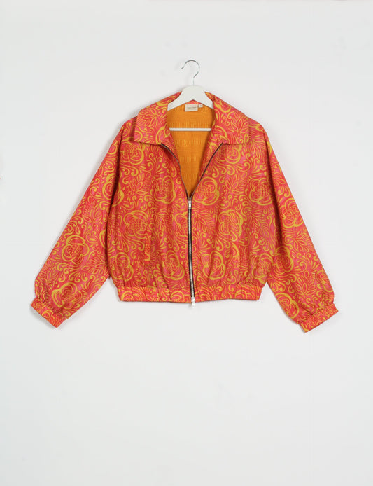 Stylish BOMBER JACKET, an upcycled clothing masterpiece with a cute cropped shape, elasticated details, and detachable metallic zipper. Contrast sari print lining adds a unique touch. Explore sustainable and eco-friendly fashion.