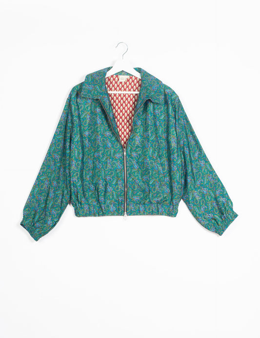 Stylish BOMBER JACKET, an upcycled clothing masterpiece with a cute cropped shape, elasticated details, and detachable metallic zipper. Contrast sari print lining adds a unique touch. Explore sustainable and eco-friendly fashion.