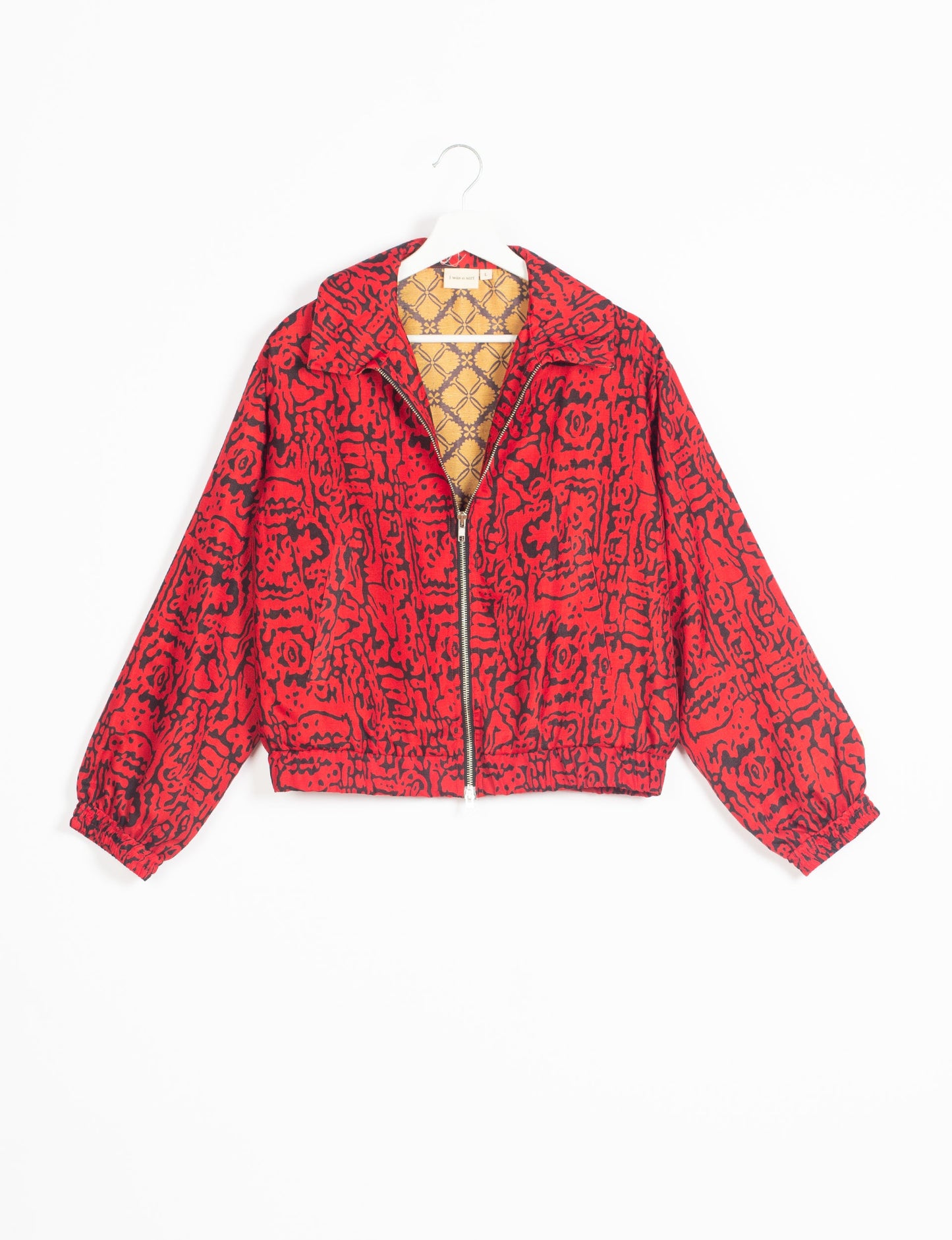 Stylish BOMBER JACKET, an upcycled clothing masterpiece with a cute cropped shape, elasticated details, and detachable metallic zipper. Contrast sari print lining adds a unique touch. Explore sustainable and eco-friendly fashion.