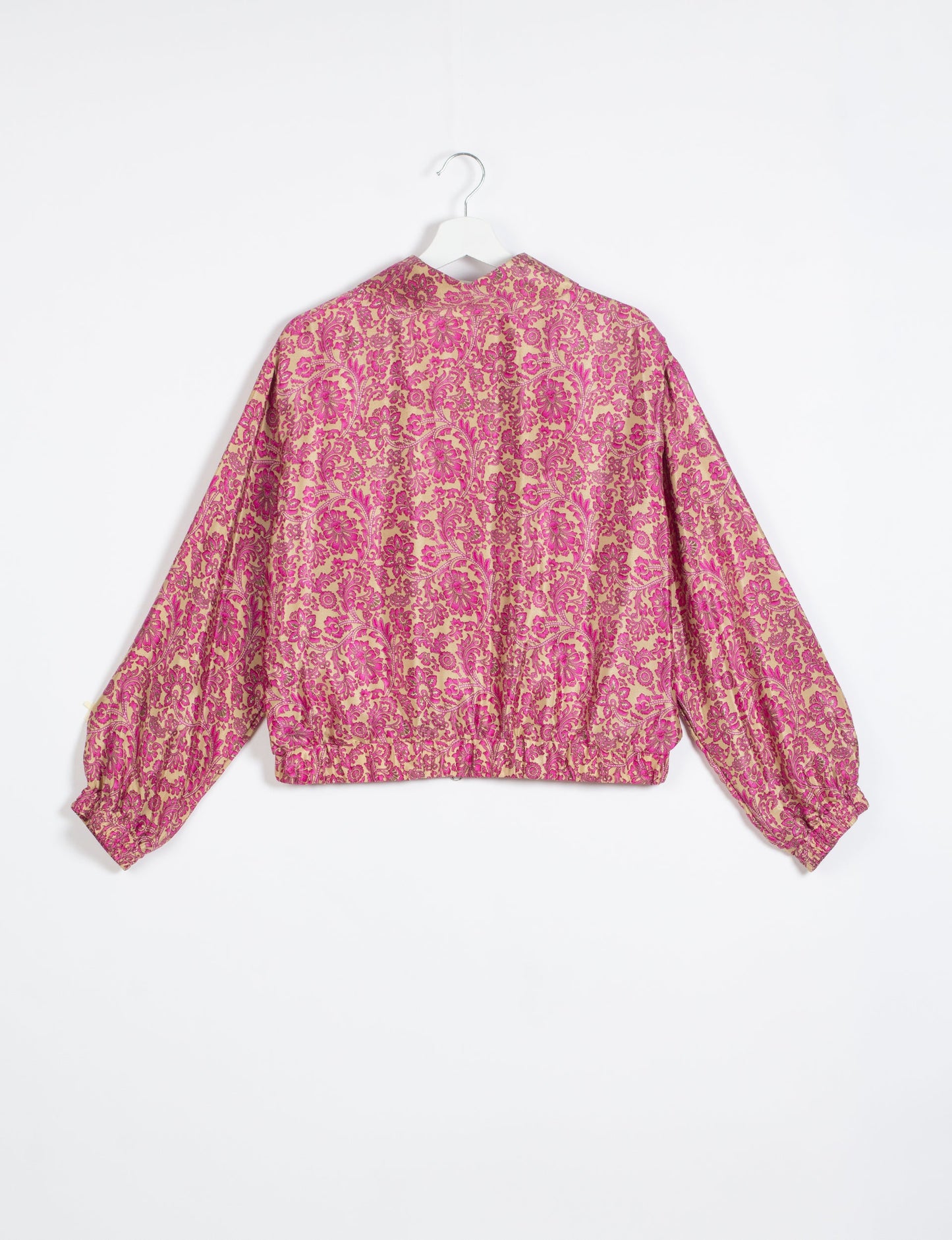 Stylish BOMBER JACKET, an upcycled clothing masterpiece with a cute cropped shape, elasticated details, and detachable metallic zipper. Contrast sari print lining adds a unique touch. Explore sustainable and eco-friendly fashion.