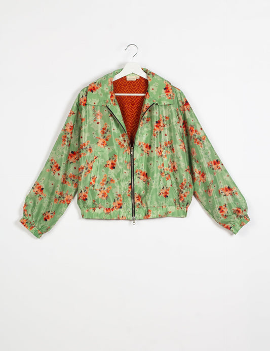 Stylish BOMBER JACKET, an upcycled clothing masterpiece with a cute cropped shape, elasticated details, and detachable metallic zipper. Contrast sari print lining adds a unique touch. Explore sustainable and eco-friendly fashion.