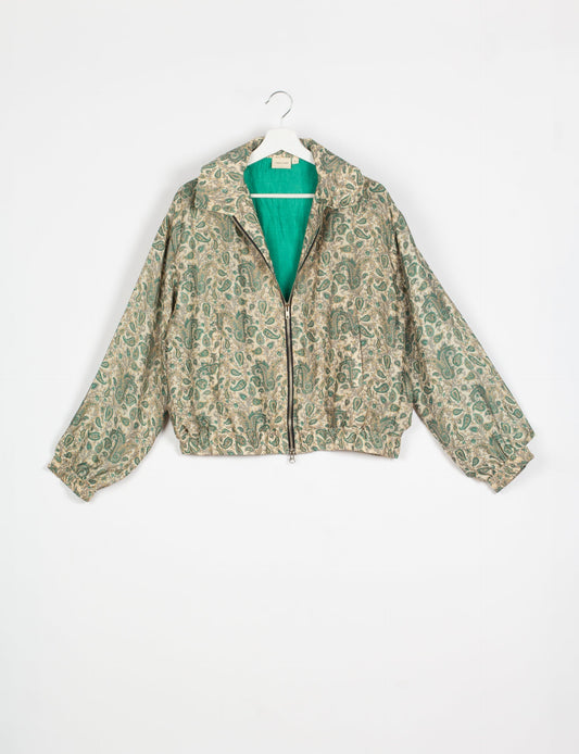 Stylish BOMBER JACKET, an upcycled clothing masterpiece with a cute cropped shape, elasticated details, and detachable metallic zipper. Contrast sari print lining adds a unique touch. Explore sustainable and eco-friendly fashion.